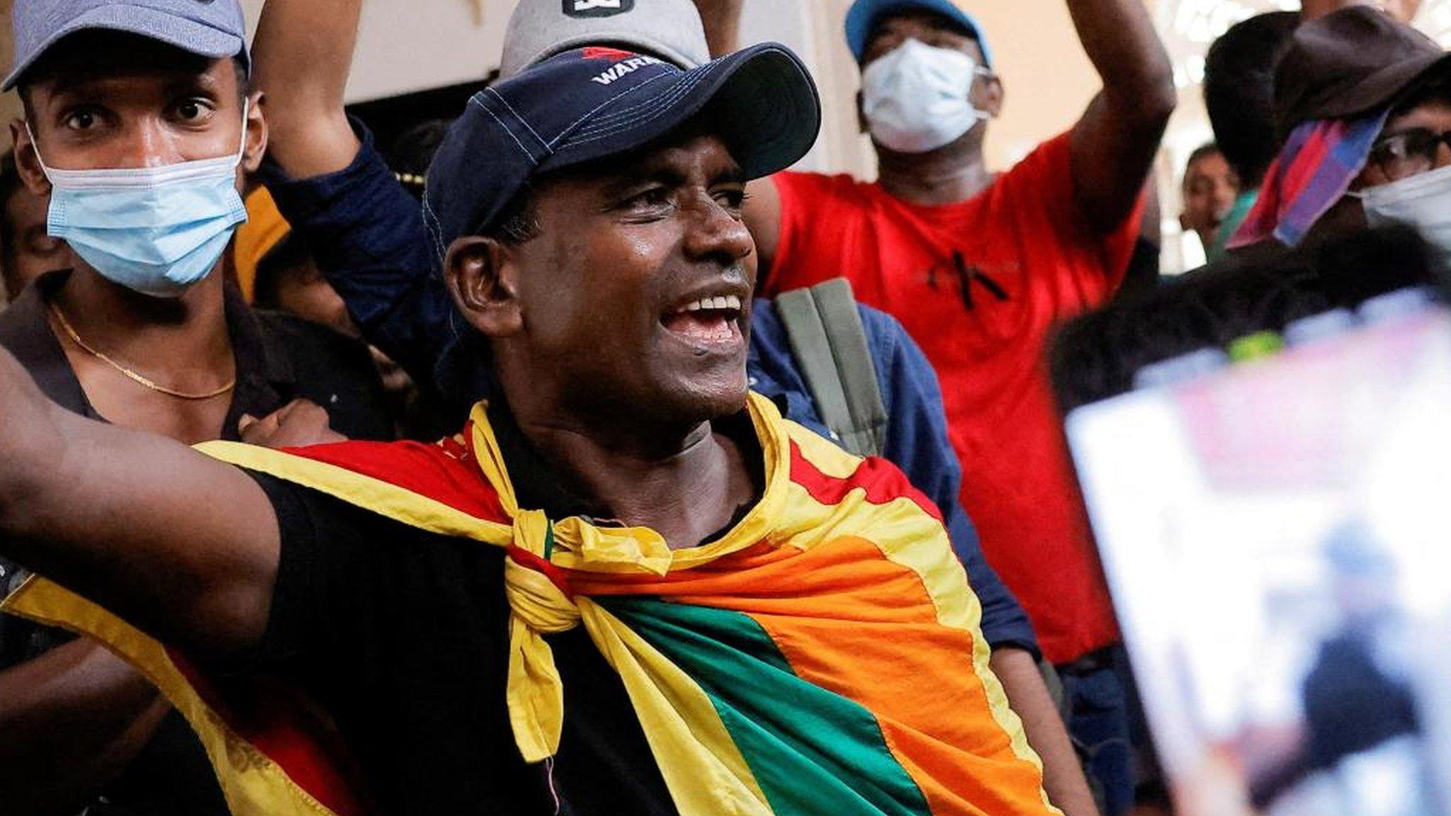 Protestors demanding the resignation of Sri Lanka's President Gotabaya Rajapaksa gather inside the Presidential Palace in Colombo on July 9, 2022