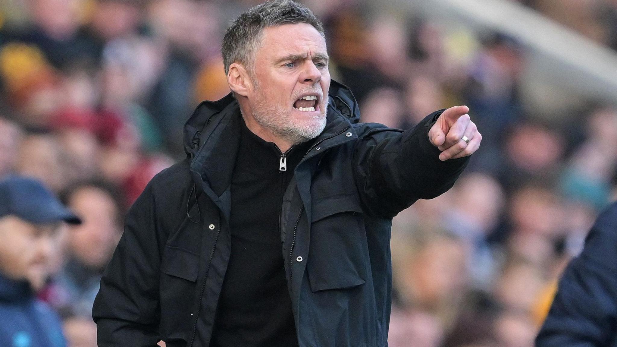 Bradford City boss Graham Alexander shouts instructions during his side's home game against Cardiff City in January