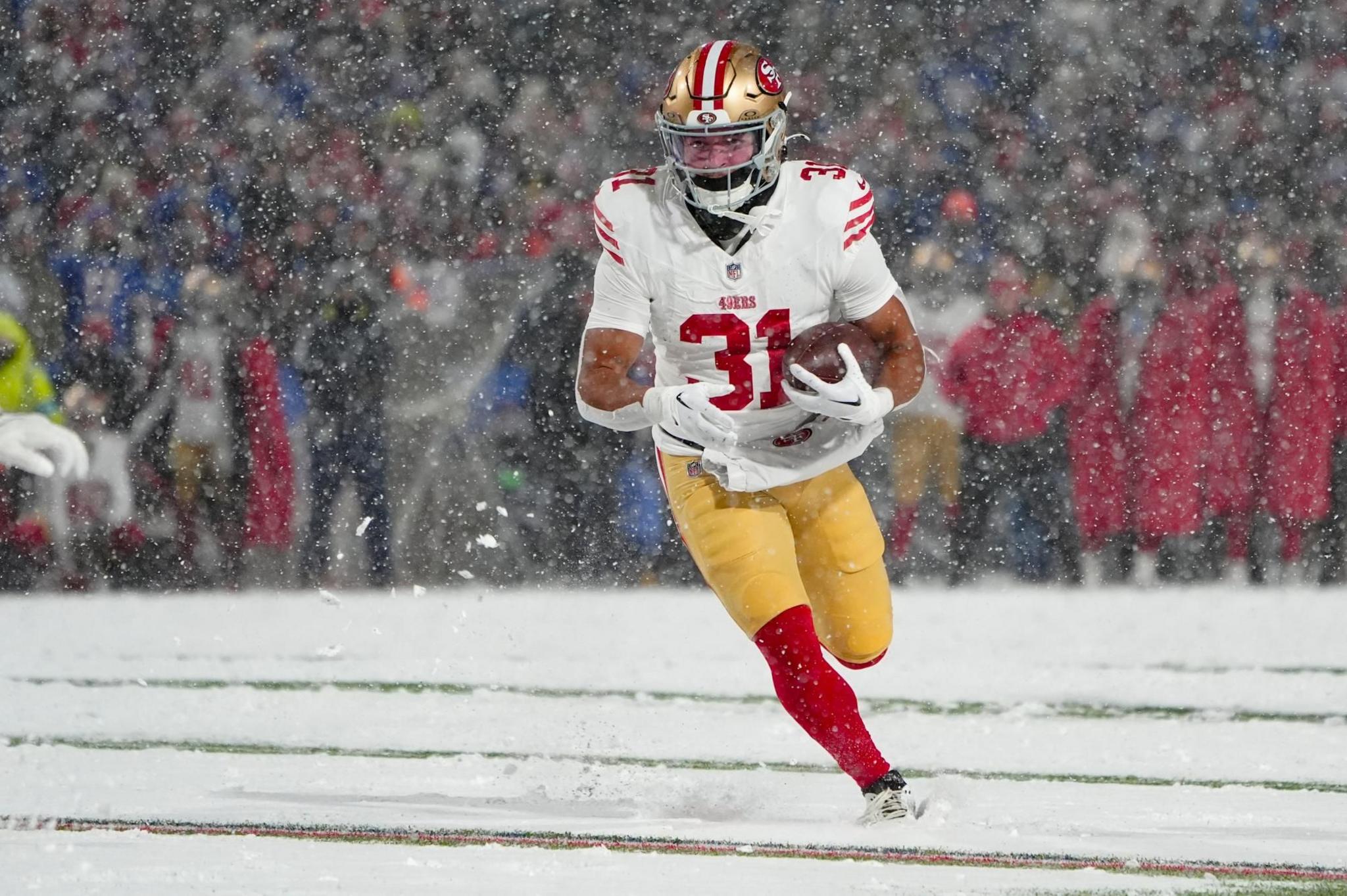 San Francisco 49ers running back Isaac Guerendo runs with the ball for a touchdown against the Buffalo Bills 