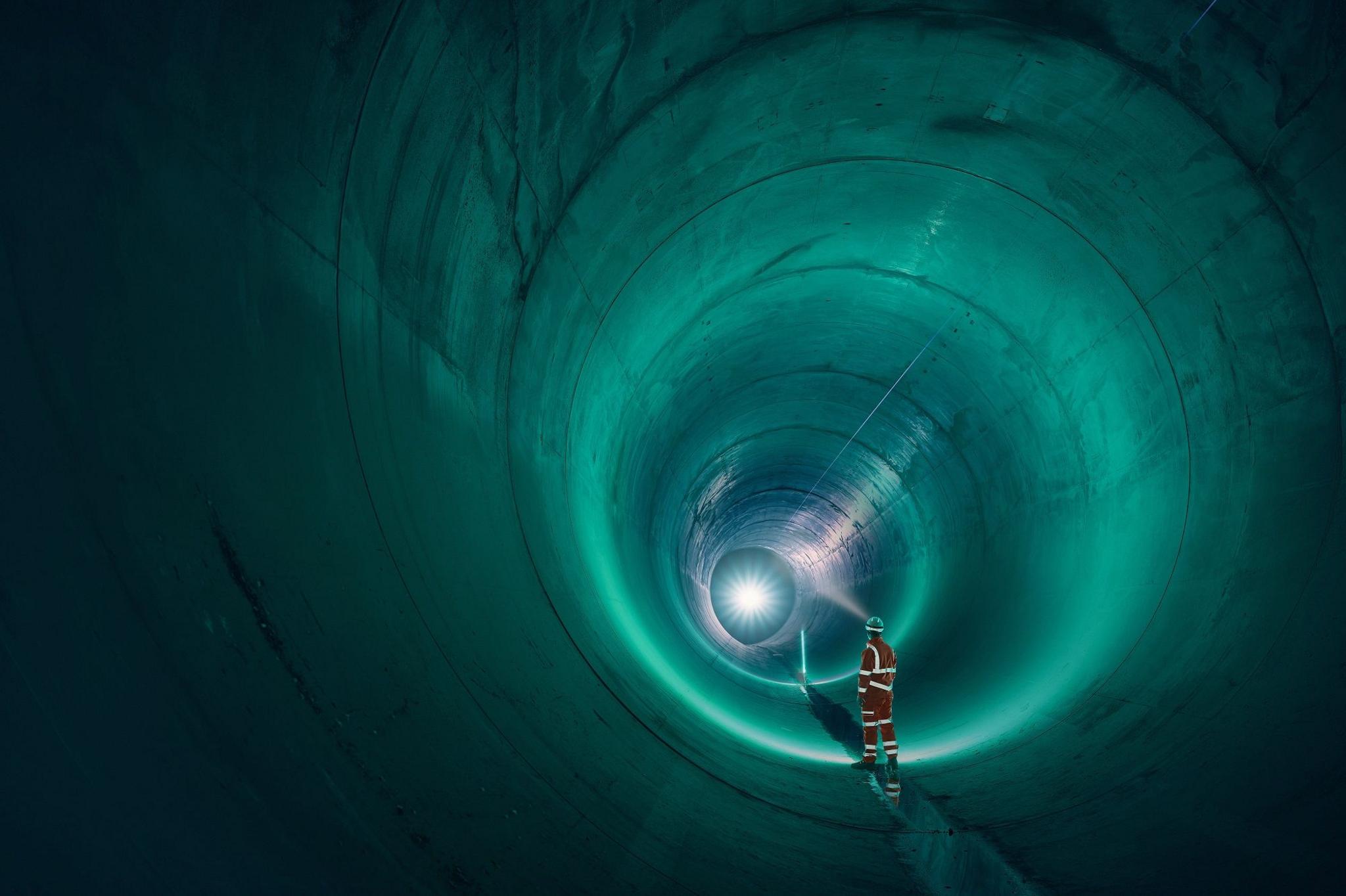 Man stands in the Thames Tideway in the final stages of construction