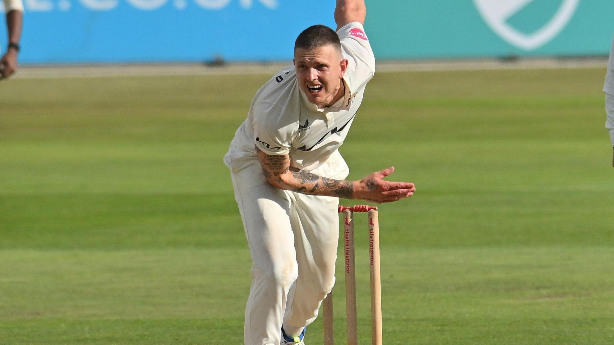 Conor McKerr bowling for Surrey in the County Championship