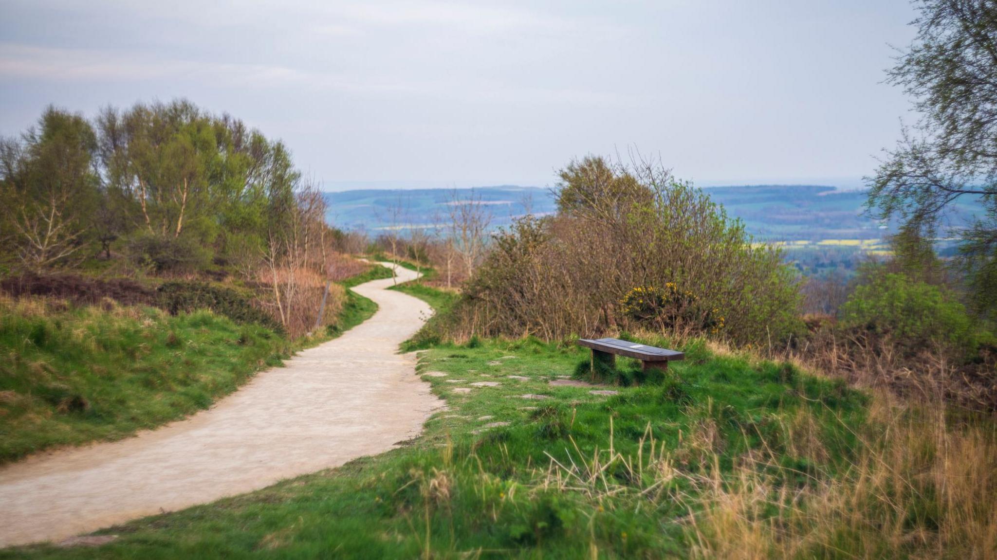 A footpath and seat on Sutton Bank, a steep hill and beauty spot in the North York Moors National Park