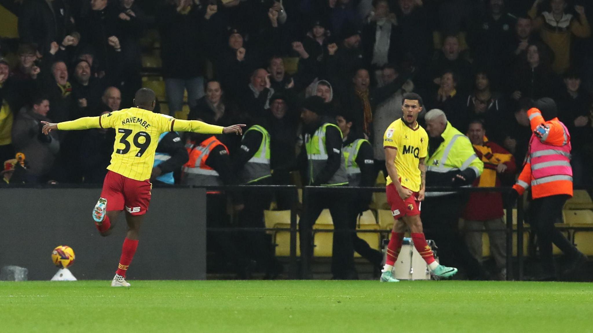 Watford's Edo Kayembe runs to celebrate with Ryan Andrews after the latter's goal for their team against Bristol City