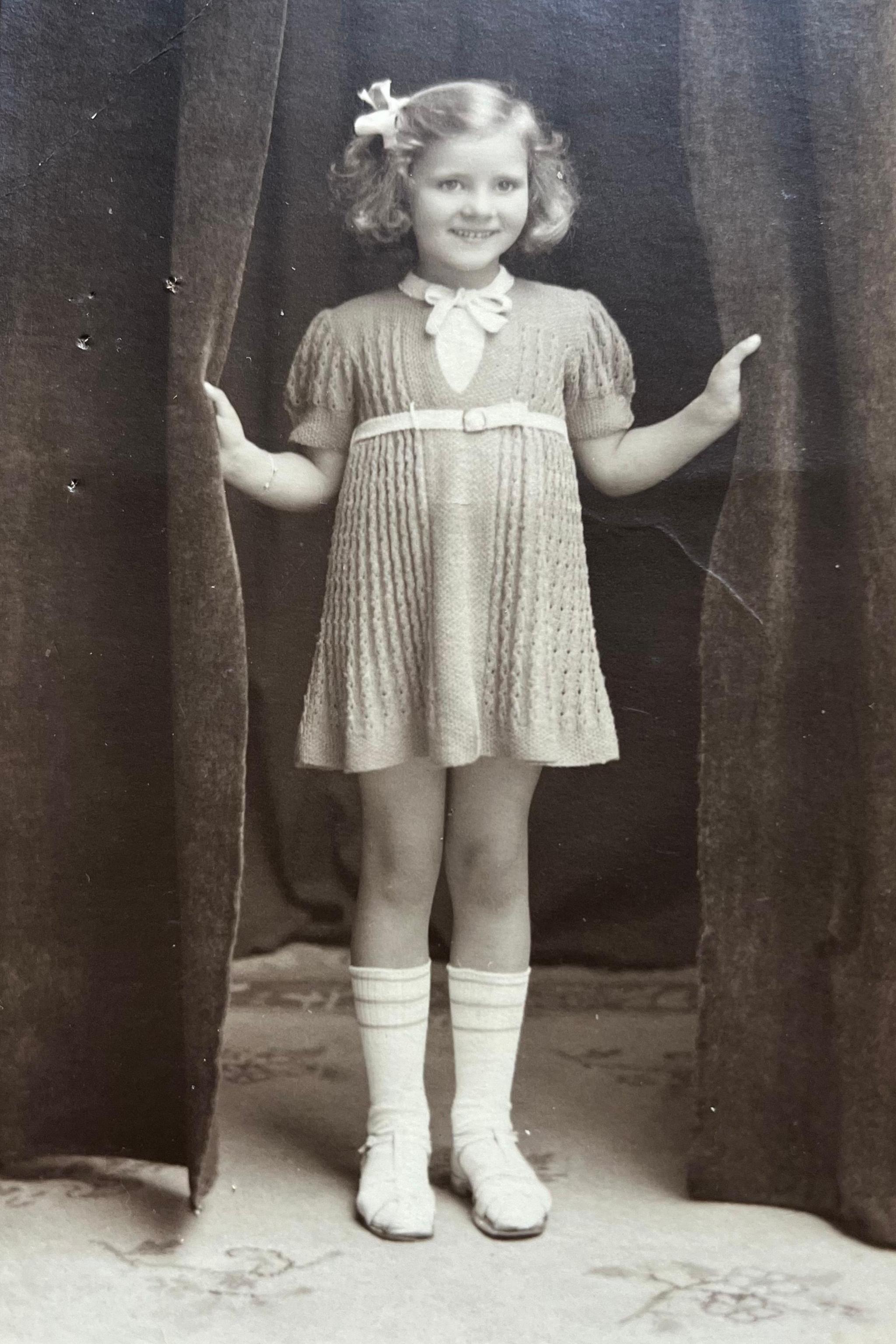 A black and white photo of Ann Mathers as a girl.