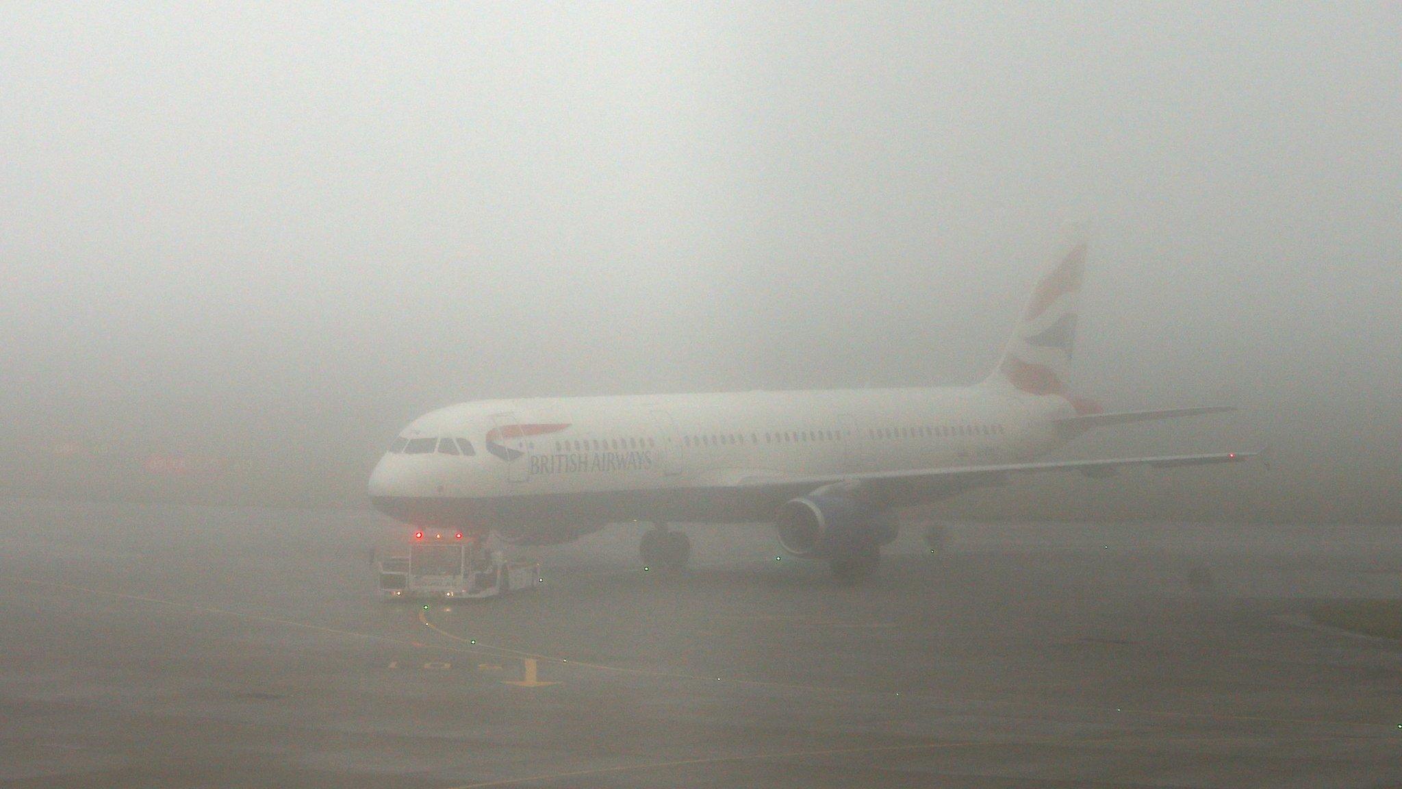 Plane in fog at Heathrow