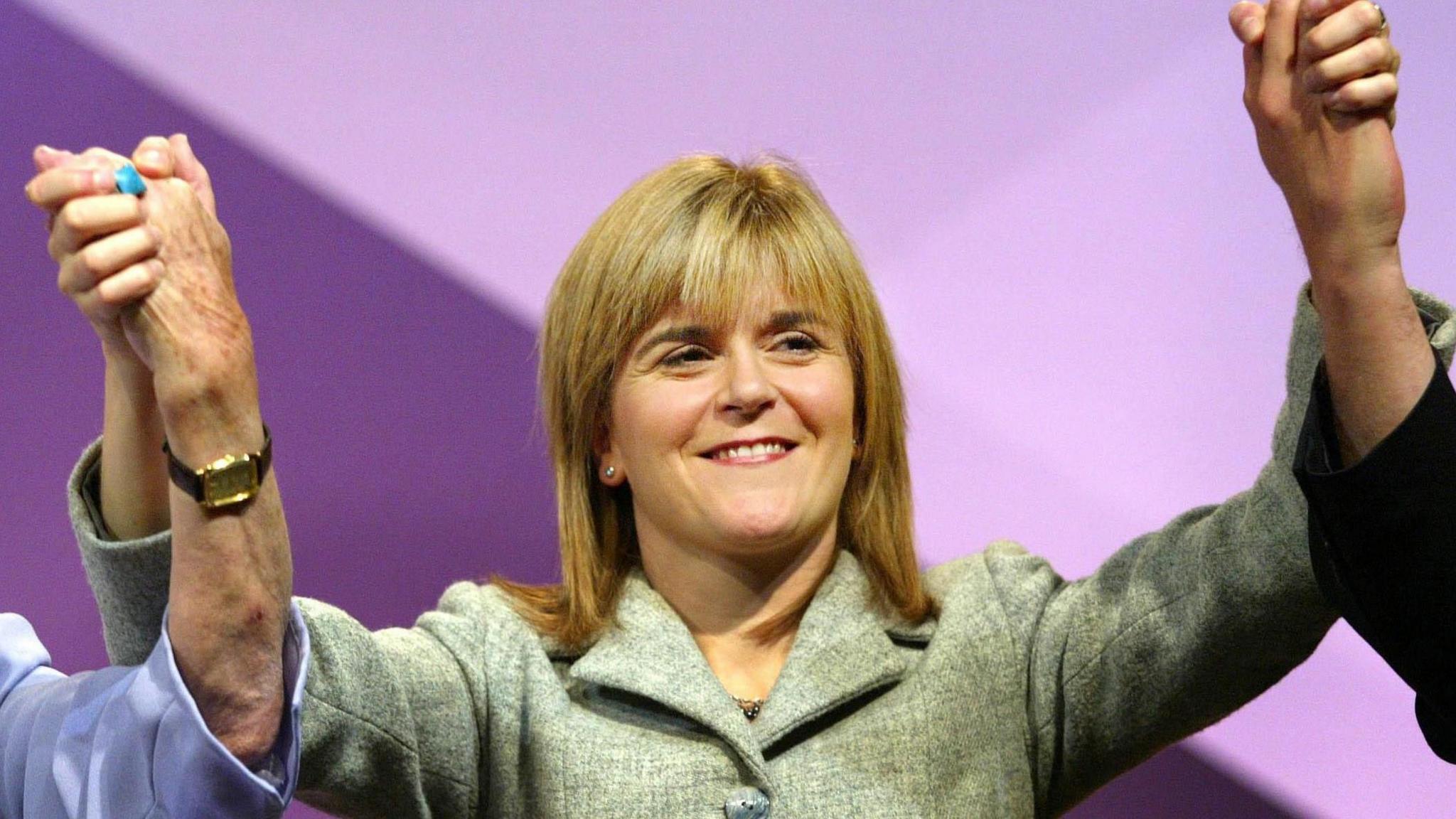 Nicola Sturgeon with her hands raised in the air after her speech at the SNP conference in 2005.