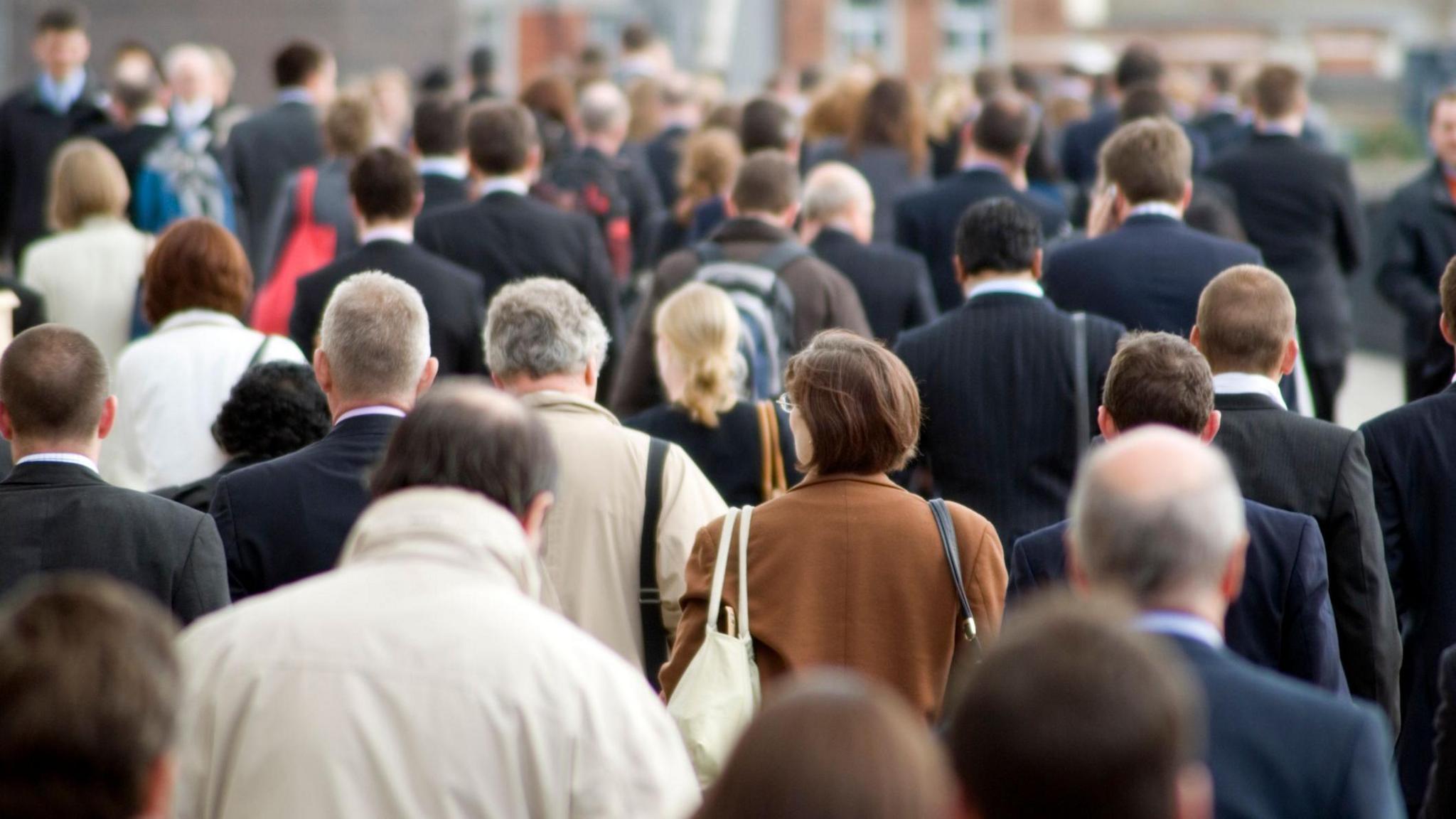 Overhead shot of people walking to work.