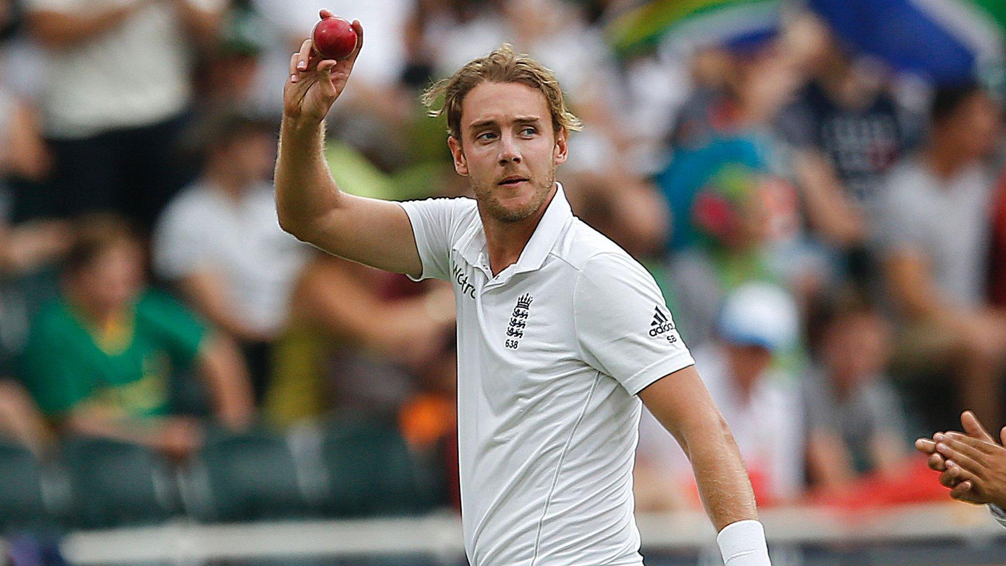 Stuart Broad holds the ball as he leaves the field