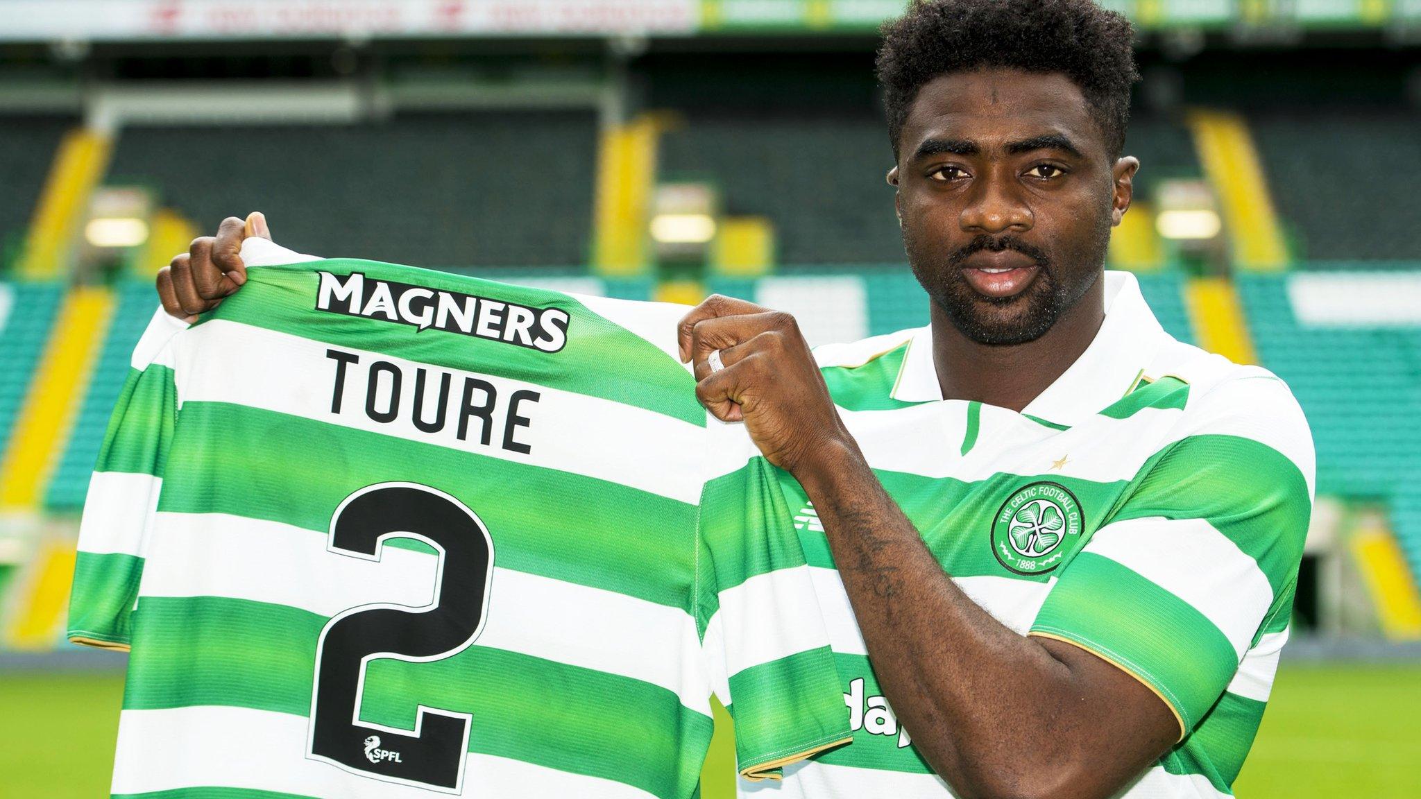 Kolo Toure shows off his new Celtic jersey