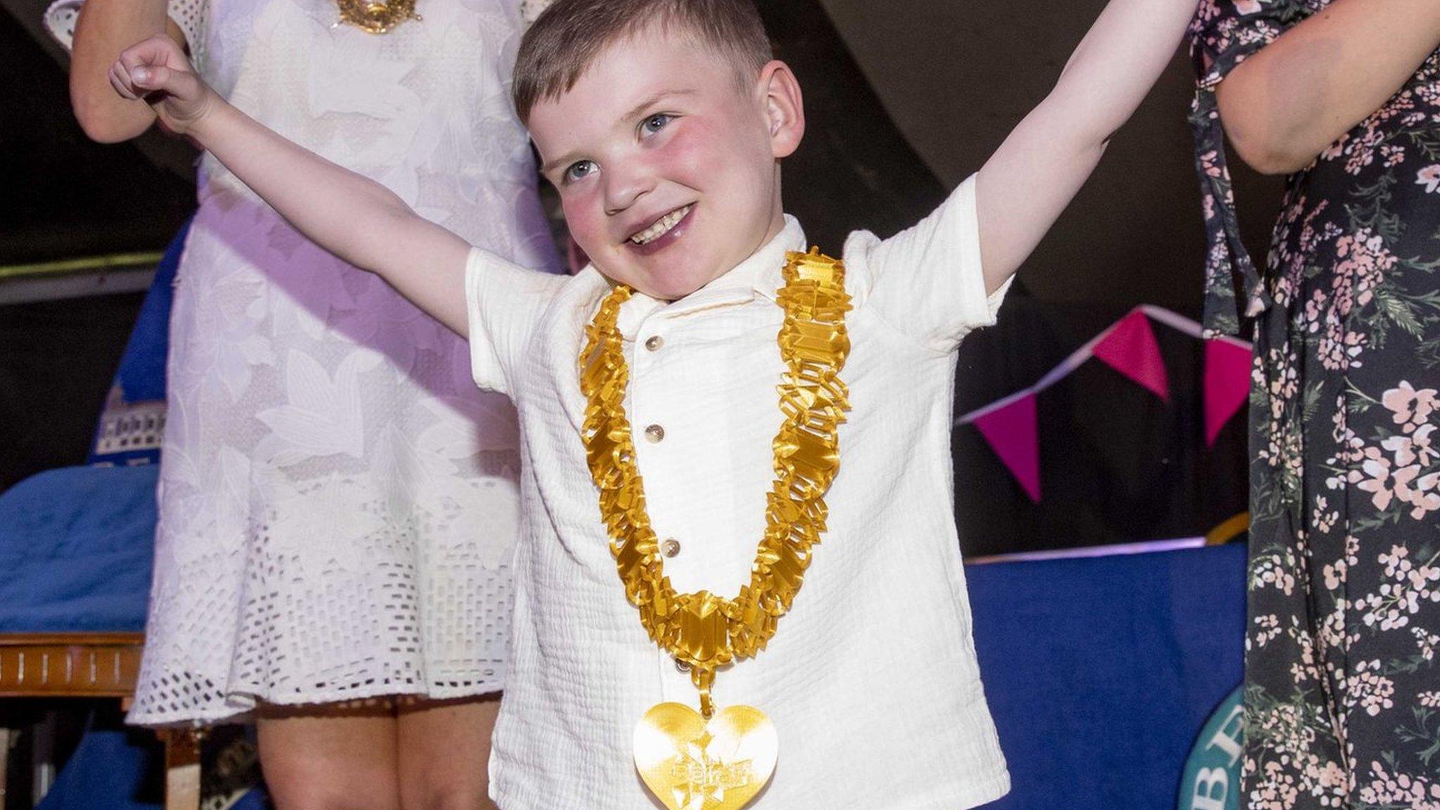 Dáithí Mac Gabhann celebrates with a key to the city around his neck