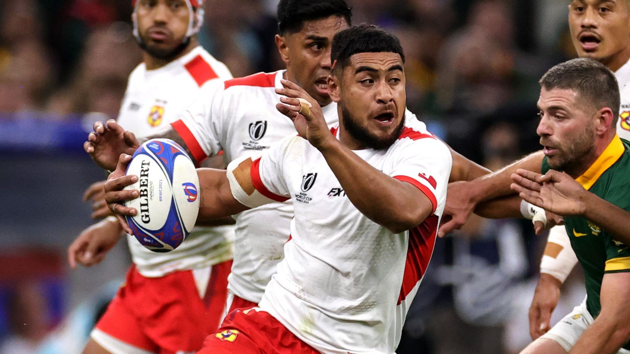 Anzelo Tuitavuki runs with the ball for Tonga against South Africa