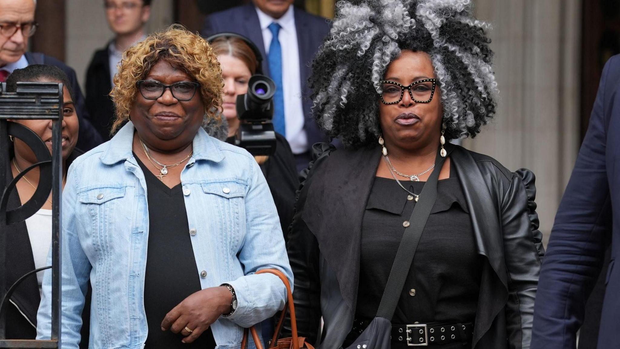 Bernadette Dugasse and Bertice Pompe, two women born on the Chagos Islands, are leaving the High Court in London.