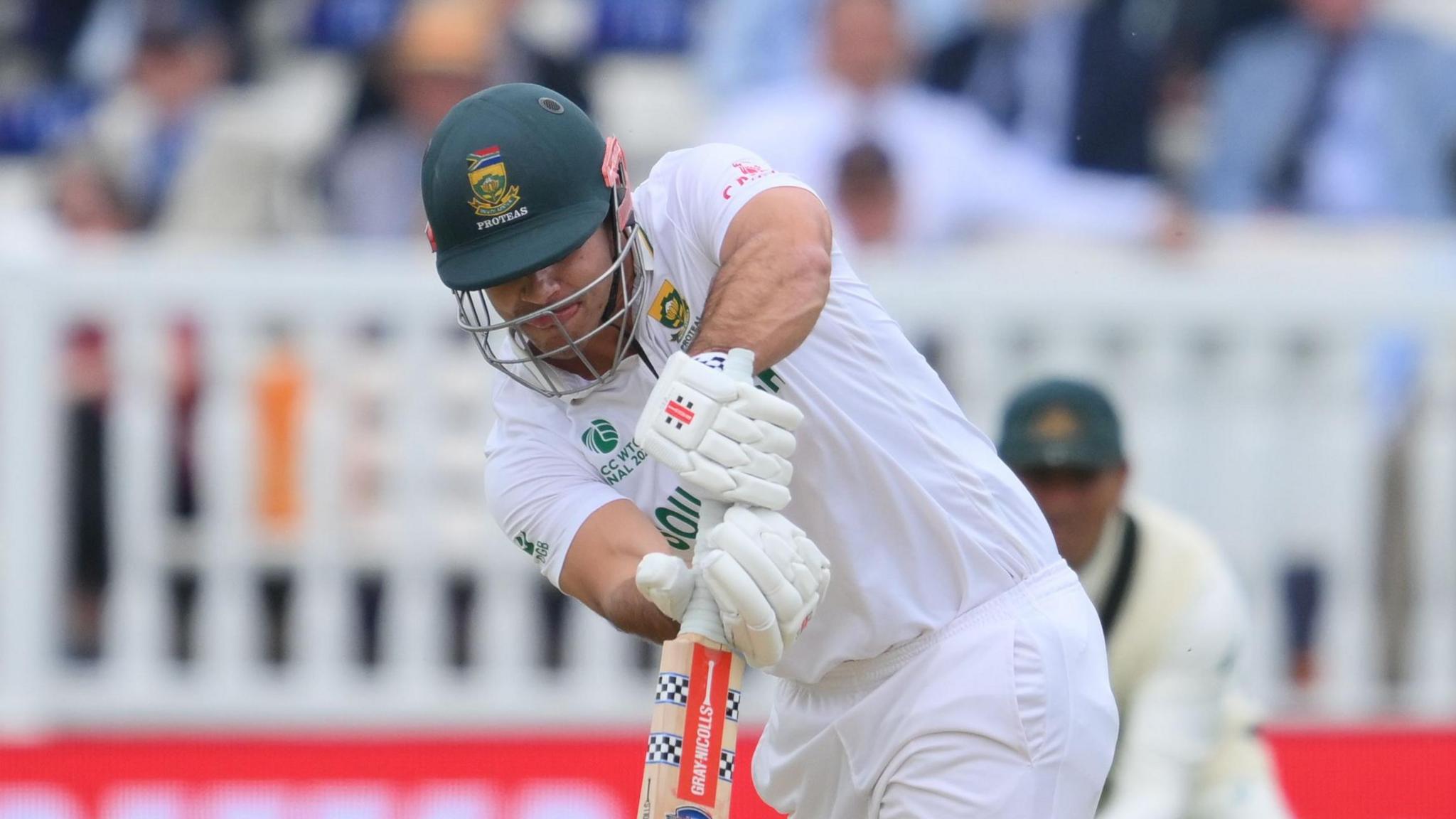 David Bedingham batting for South Africa against Australia at Lord's with his head down over the ball as he pushes it into the onside 