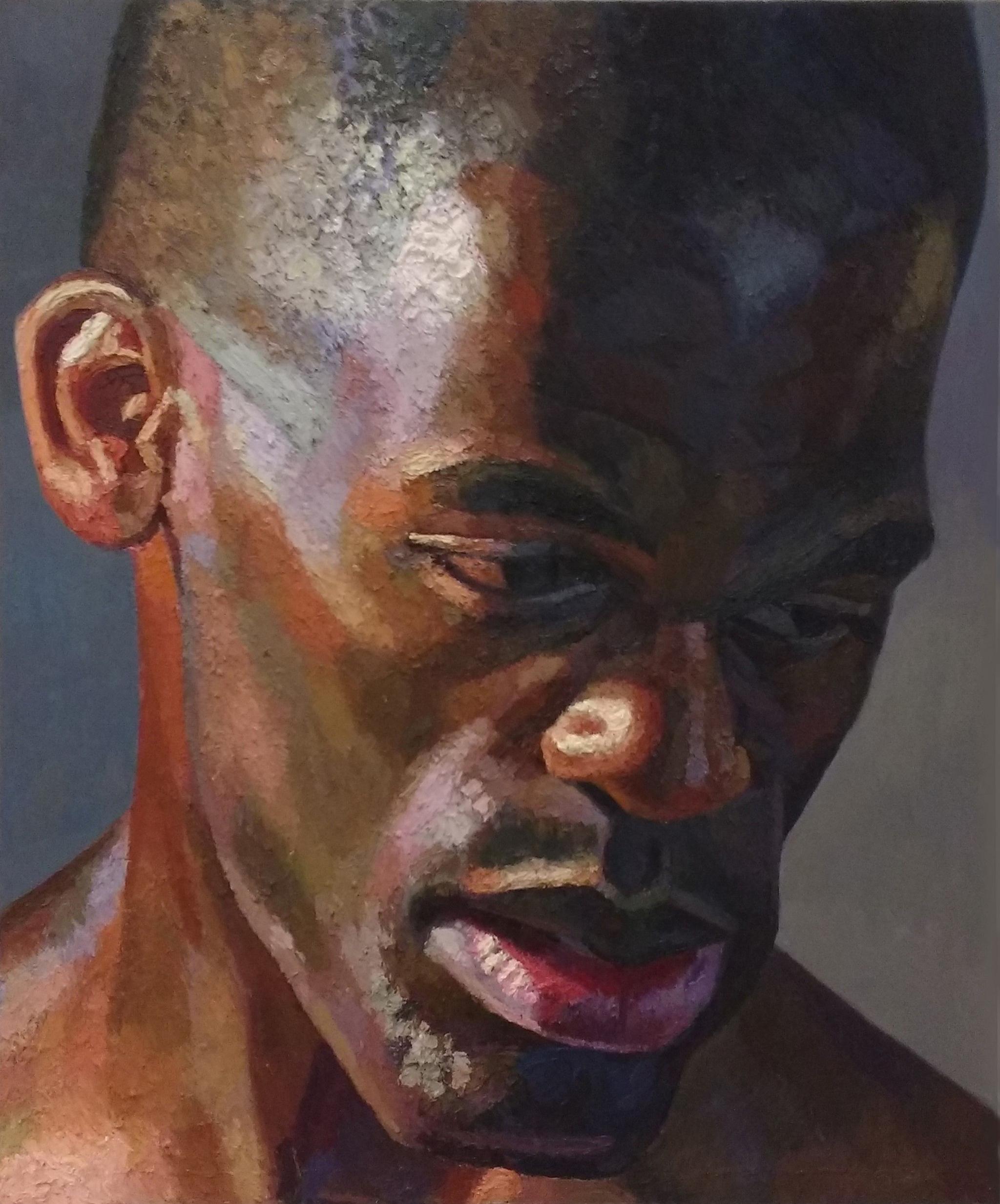 An oil painting of a man, close up.  The brush stokes pick out the colour of his skin - it is almost a study of the light on his features.