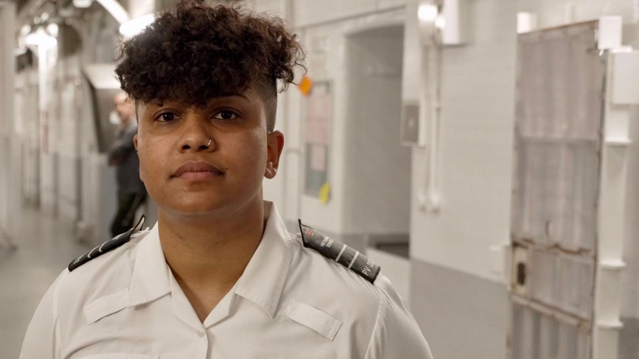 Prison officer Shay Dhury is seen on a landing in one of HMP Pentonville's wings - rows of cells where prisoners are housed.