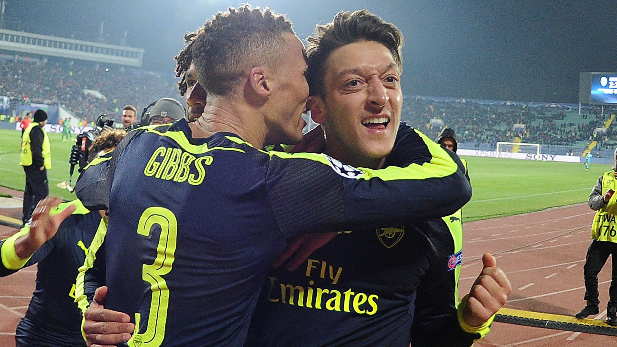 Mesut Ozil (right) celebrates his winning goal with team-mates