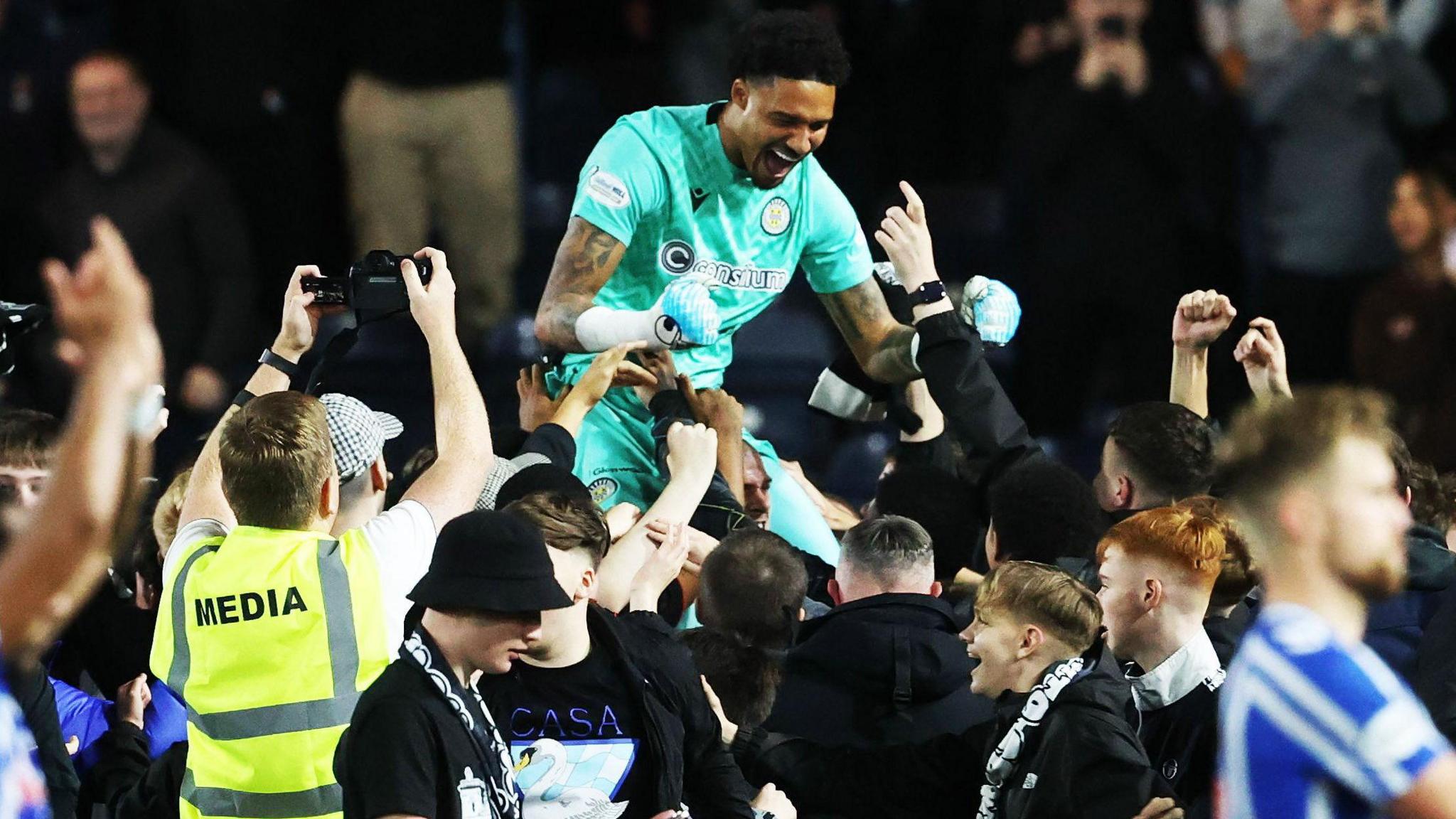 Goalkeeper Shamal George celebrates with the St Mirren fans