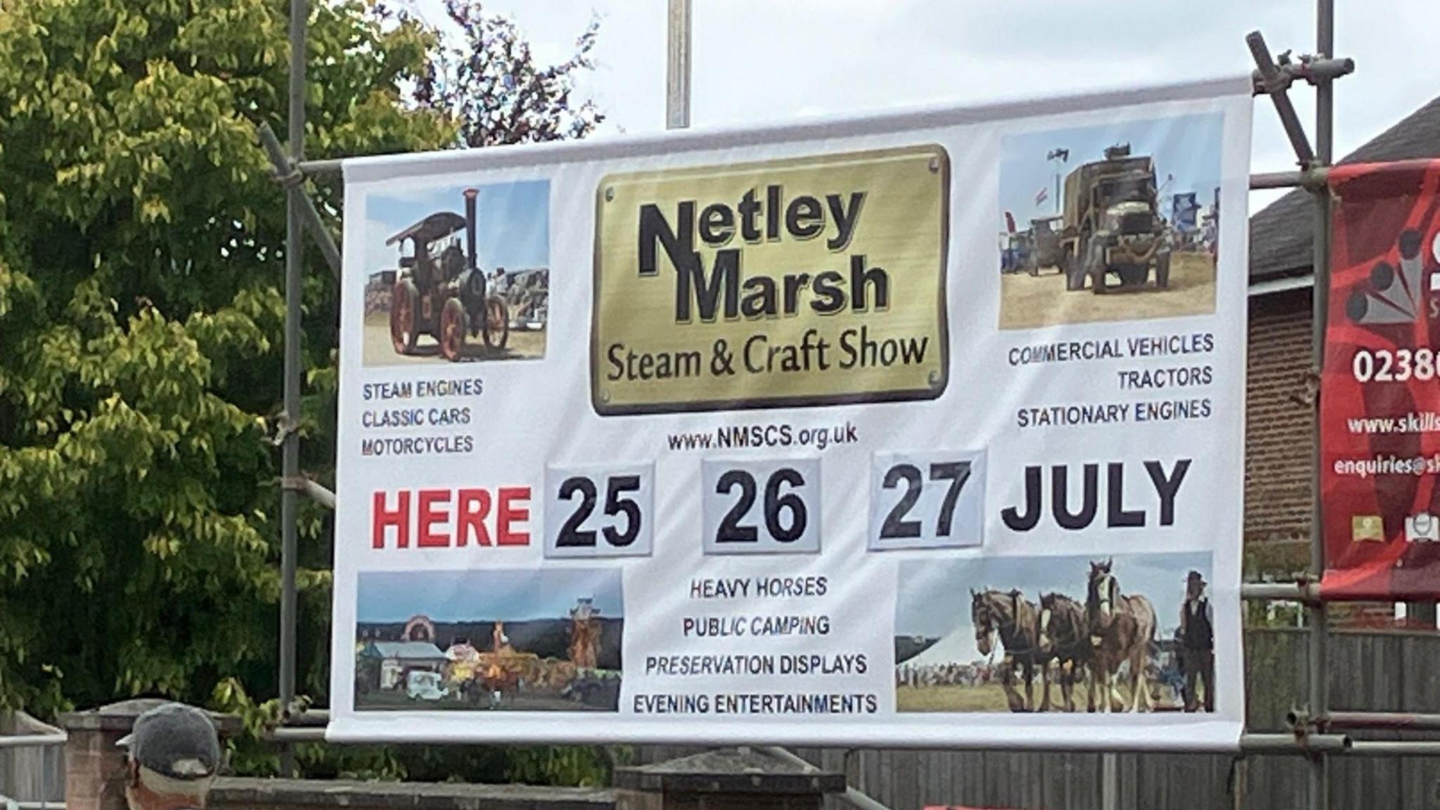 A close up image of a sign for Netley Marsh Steam and Craft Show reads 'Here 25 26 27 July' and lists various attractions at the event with pictures of steam vehicles and horses