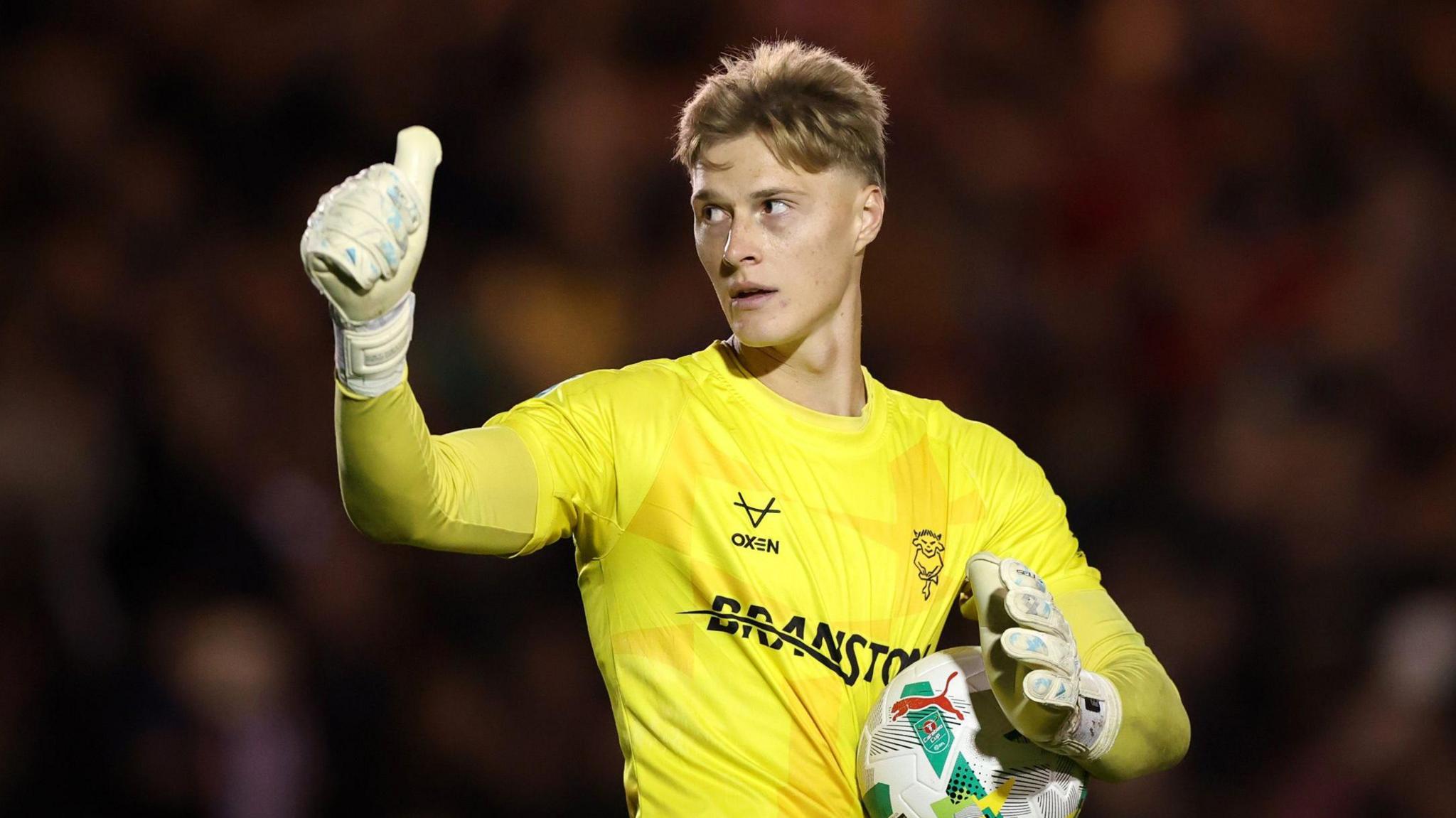 Zach Jeacock gives the thumbs up while playing for Lincoln