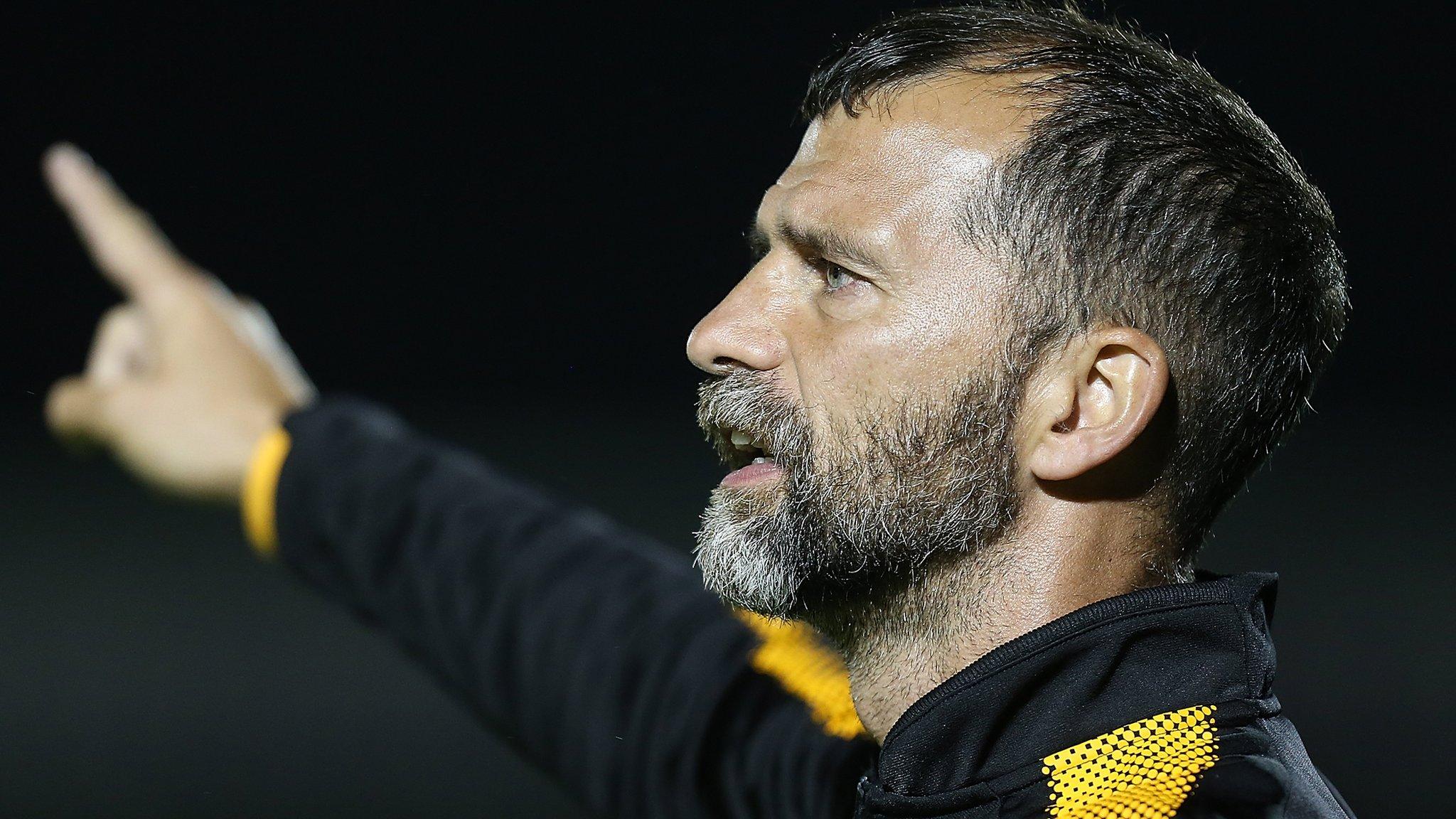 Joe Dunne gestures towards the Cambridge players