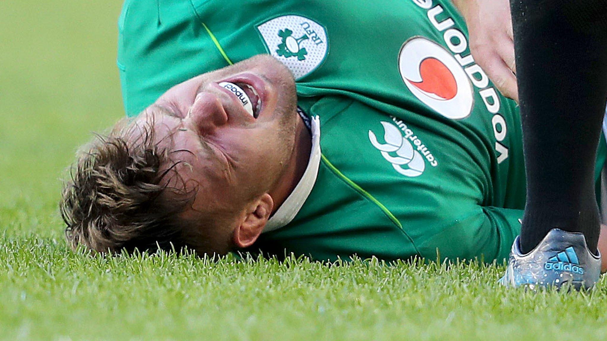 Murphy shows his pain after sustaining the injury in Ireland's historic win over New Zealand on Saturday in Chicago