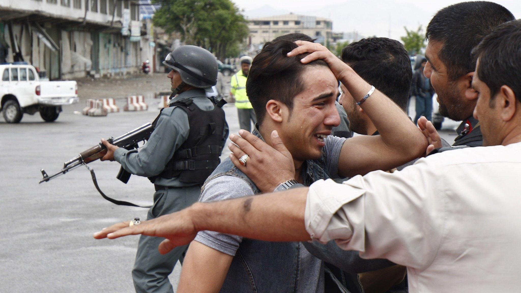 An unidentified relative of one of the victims of a suicide bomb blast in central Kabul on Tuesday 19 April 2016 reacts