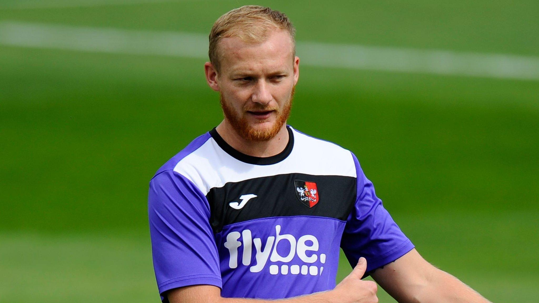 Robbie Simpson warms up for Exeter City