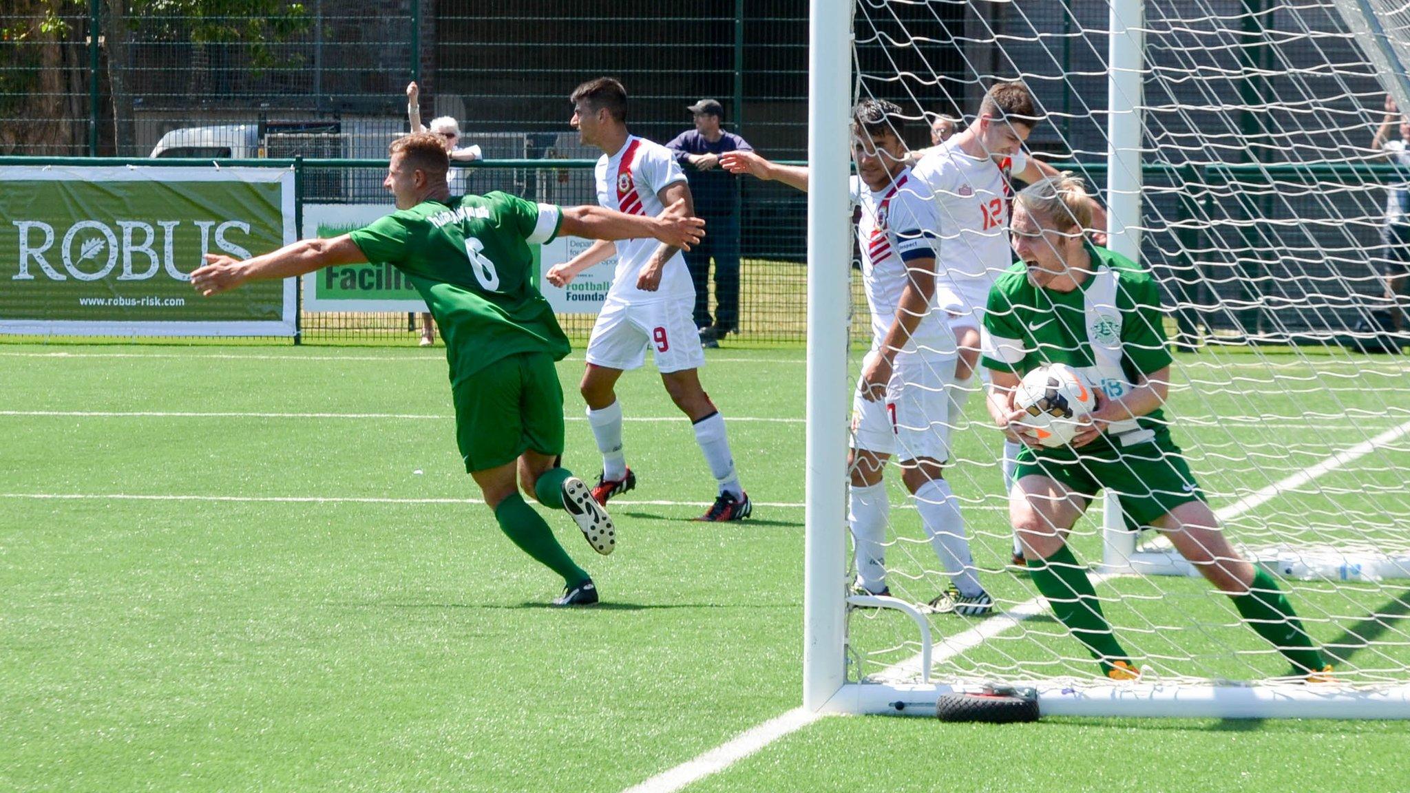 Guernsey celebrate scoring against Gibraltar