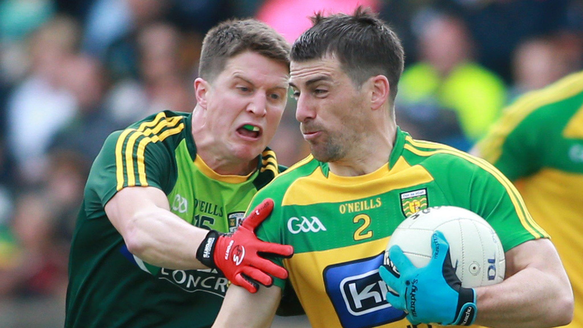 Antrim's Tomas McCann challenges Donegal's Paddy McGrath