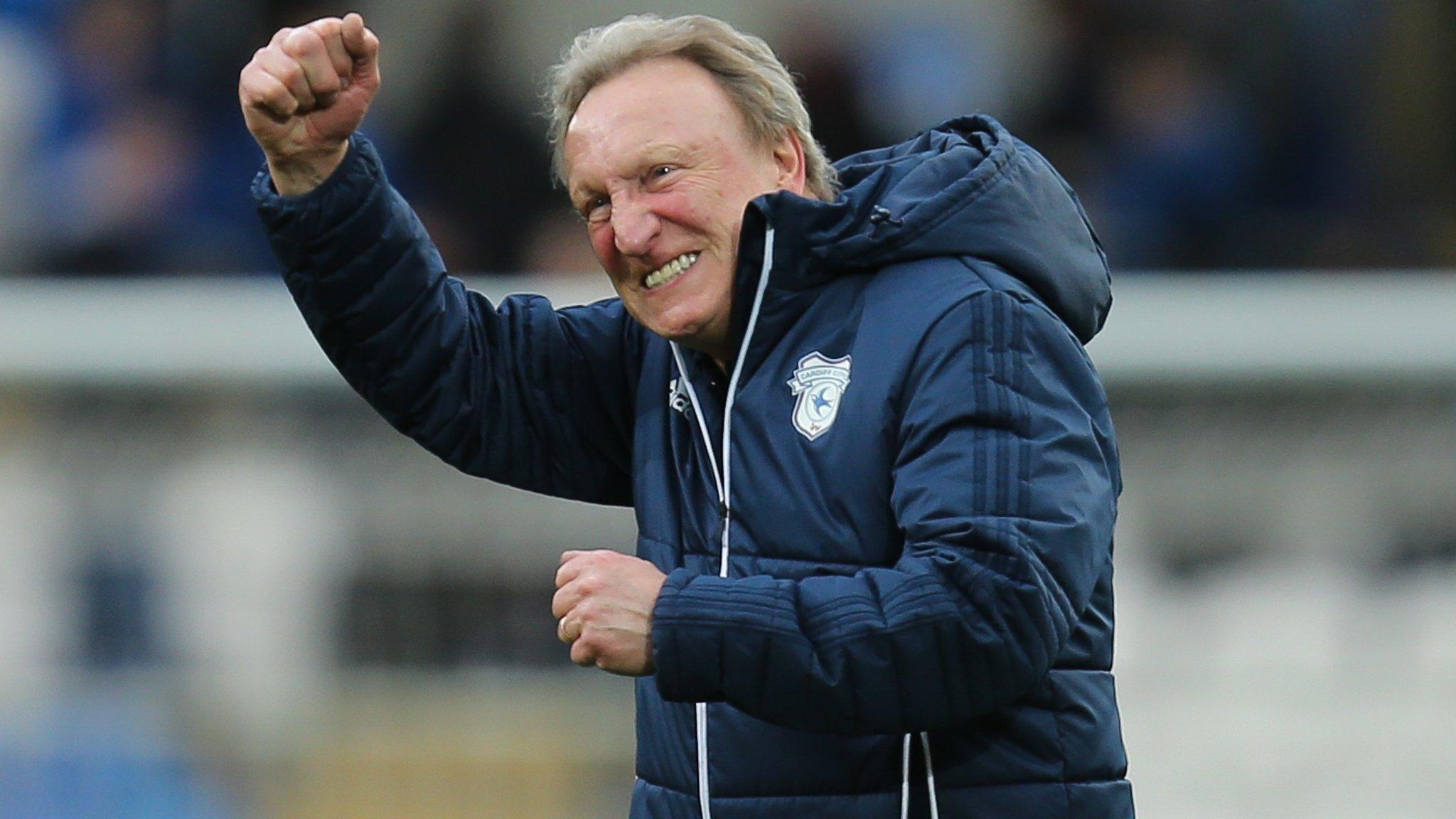 Neil Warnock celebrates post patch