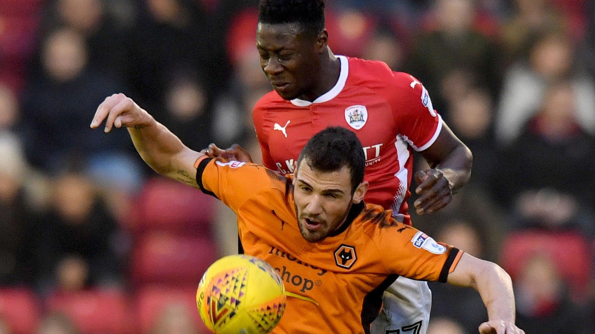 Andy Yiadom challenges Wolves' Leo Bonatini at Oakwell