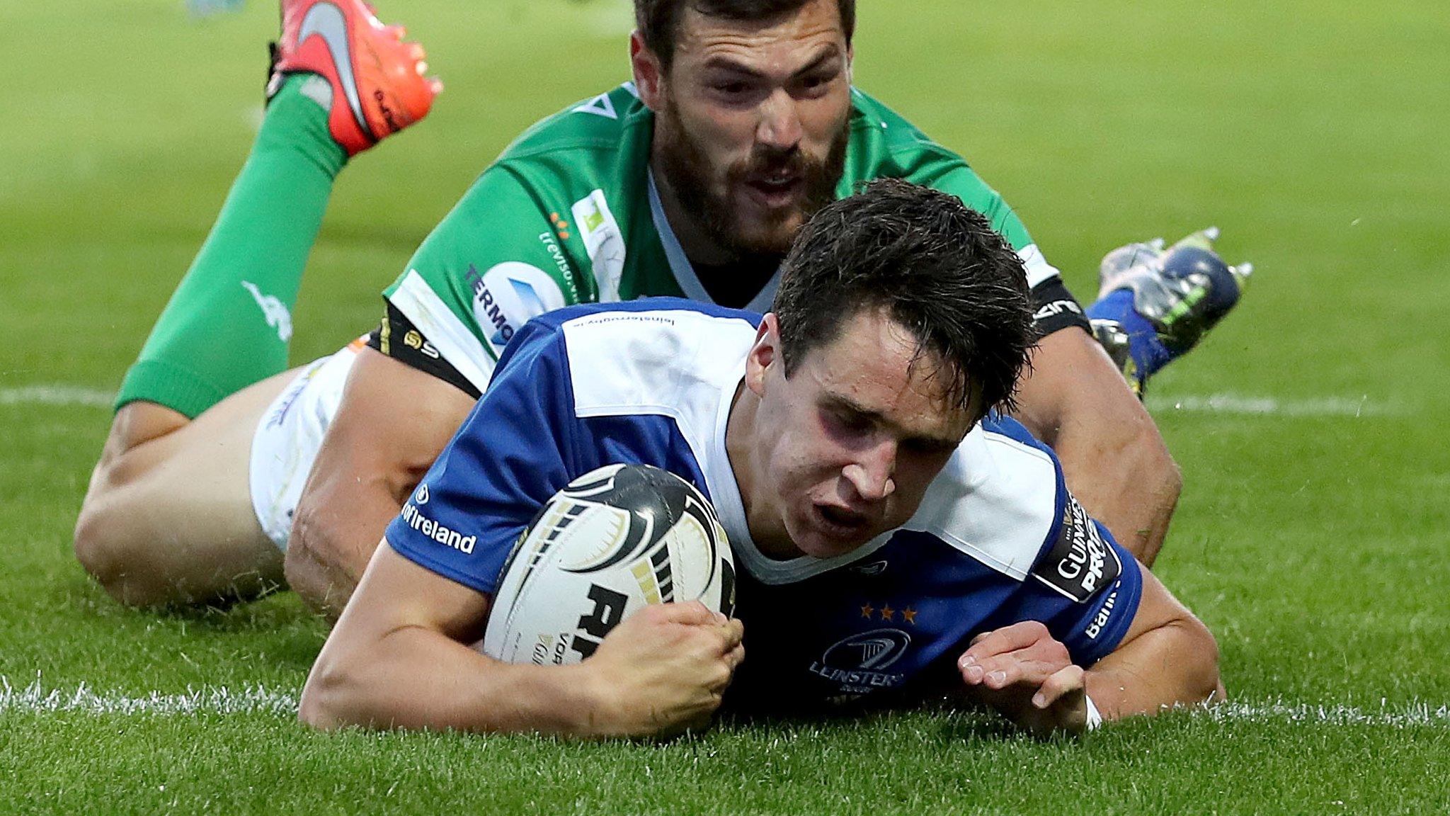 Joey Carbery scores his second try despite Jayden Hayward's efforts