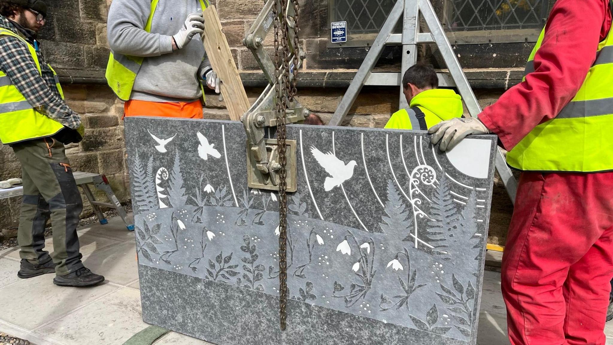 The stone being installed 