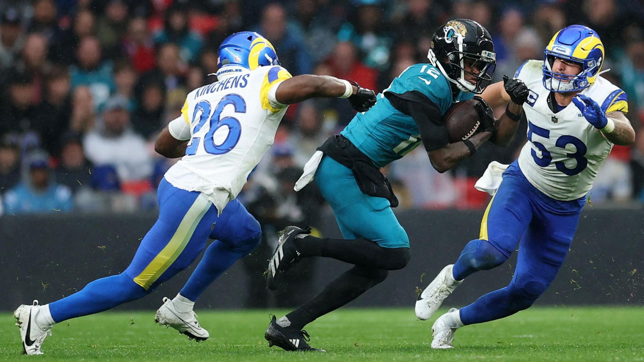 Travis Hunter runs with the ball as the Jacksonville Jaguars are beaten by the Los Angeles Rams at Wembley