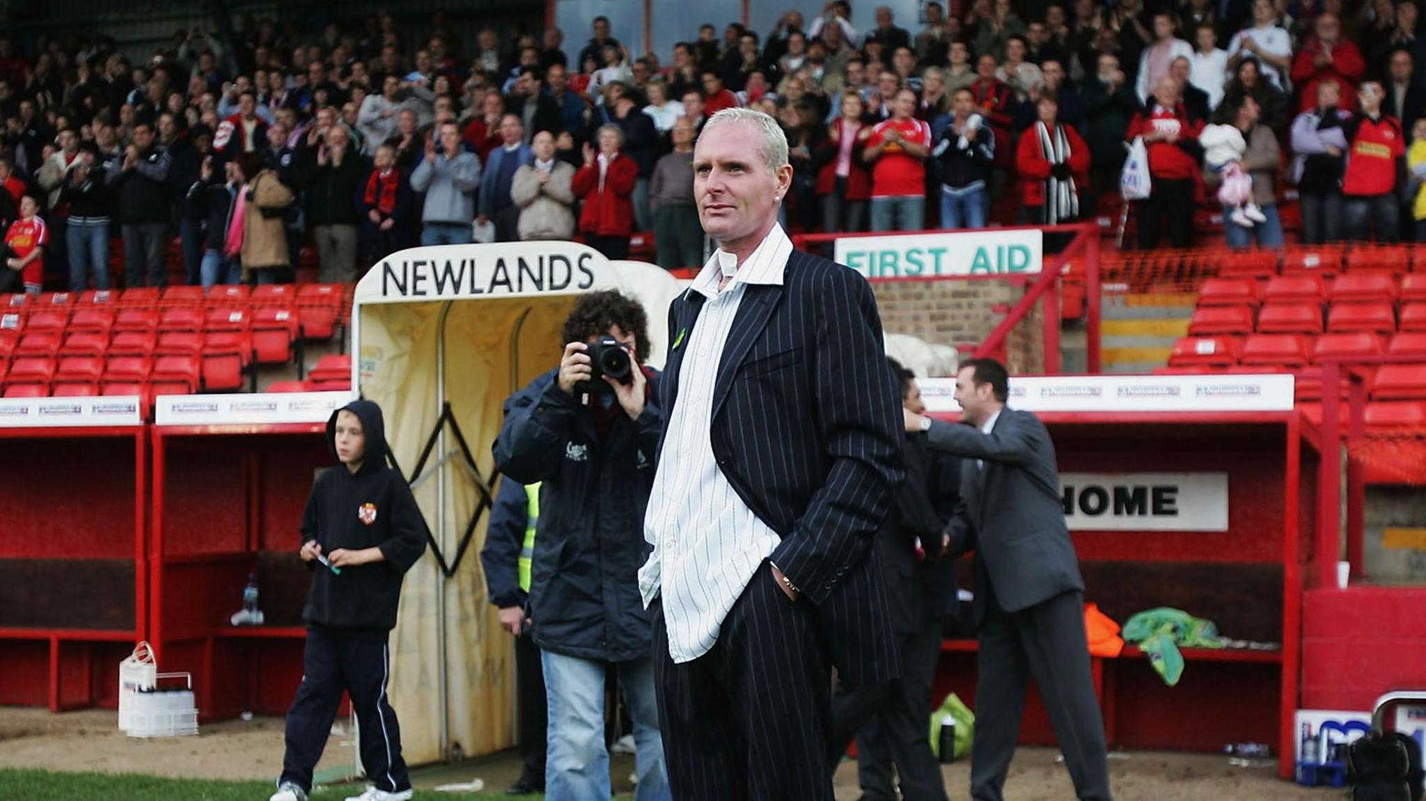 Paul Gascoigne in front of the old main stand at Kettering's former Rockingham Road home