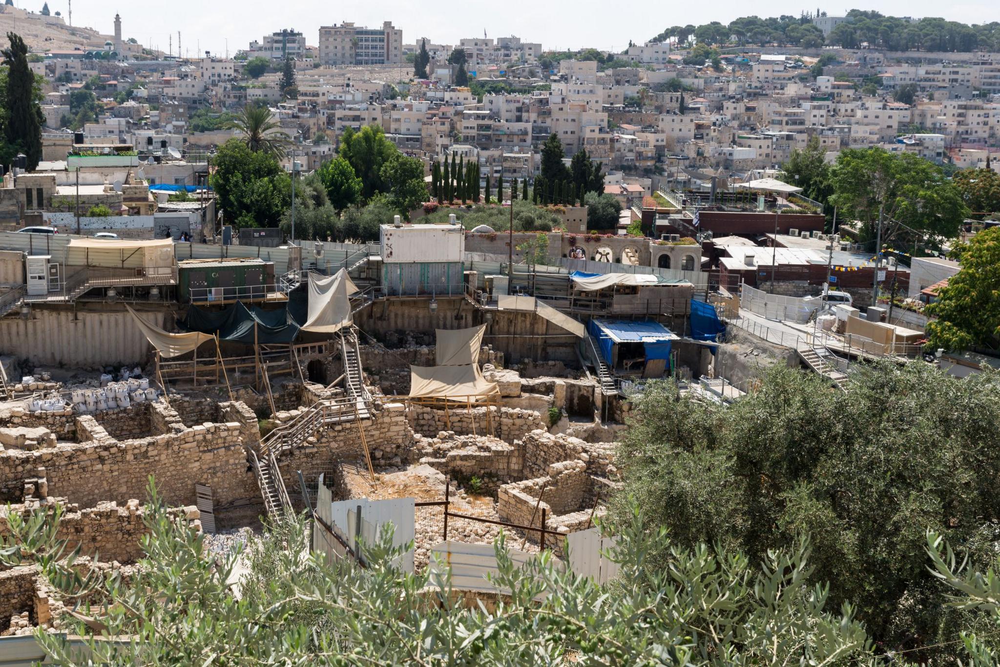 The excavation site with modern buildings of Jerusalem in the background.