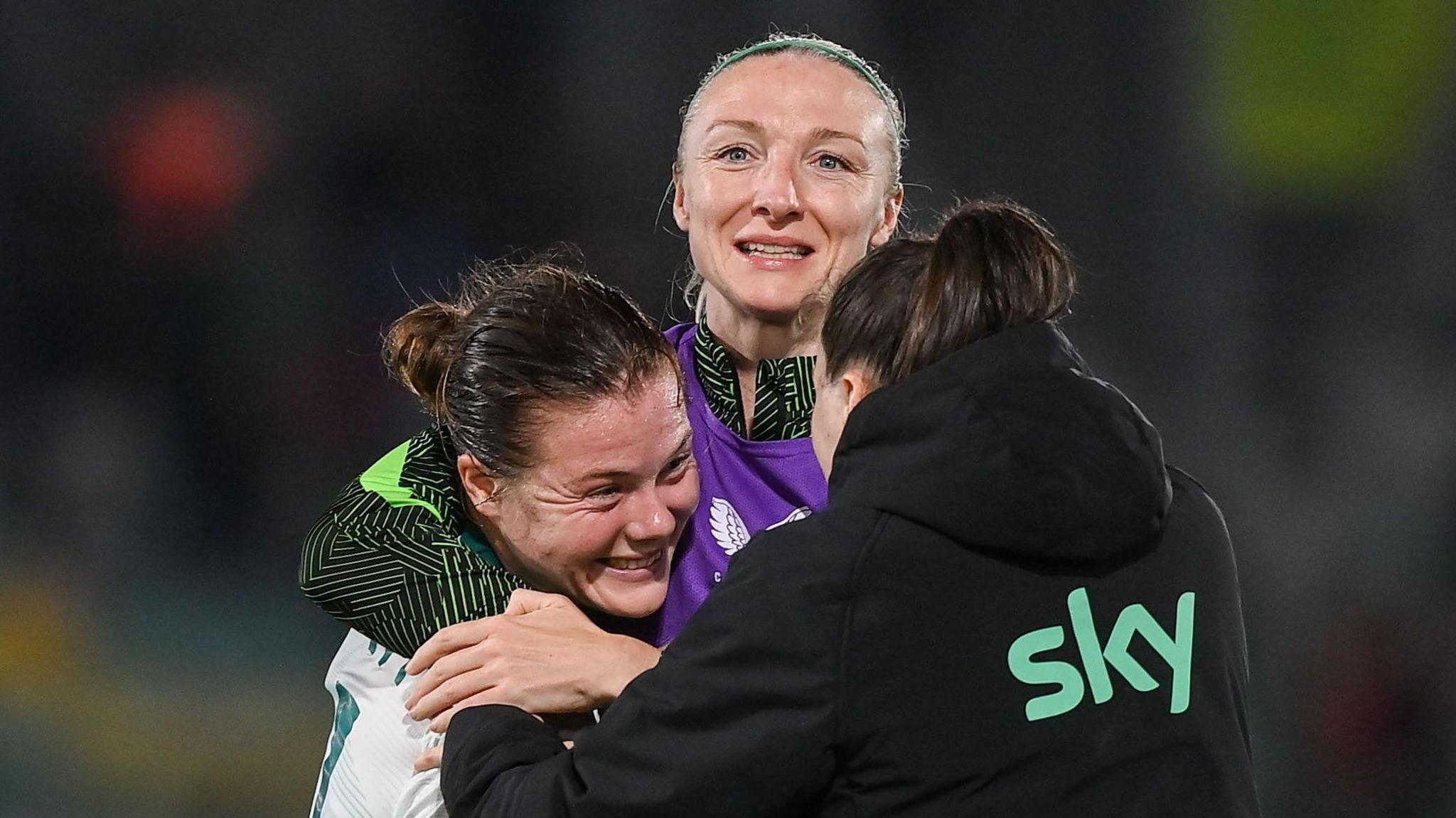 Emily Murphy celebrating after the game with Courtney Brosnan and Lucy Quinn