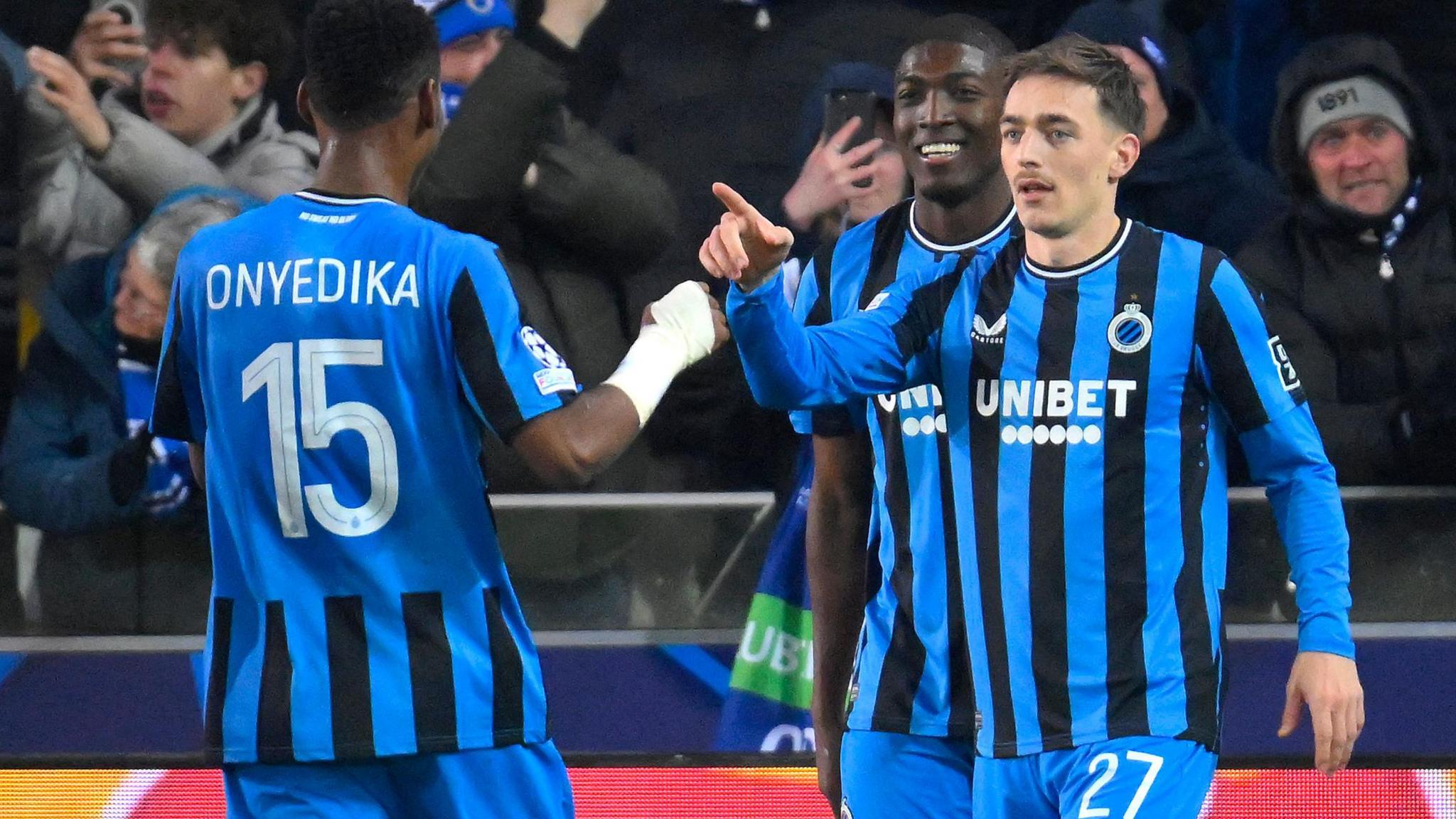 Casper Nielsen (right) celebrates with Club Brugge's Nigerian midfielder Raphael Onyedika