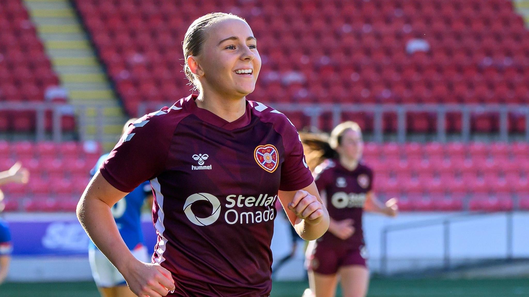 Carly Johns celebrates