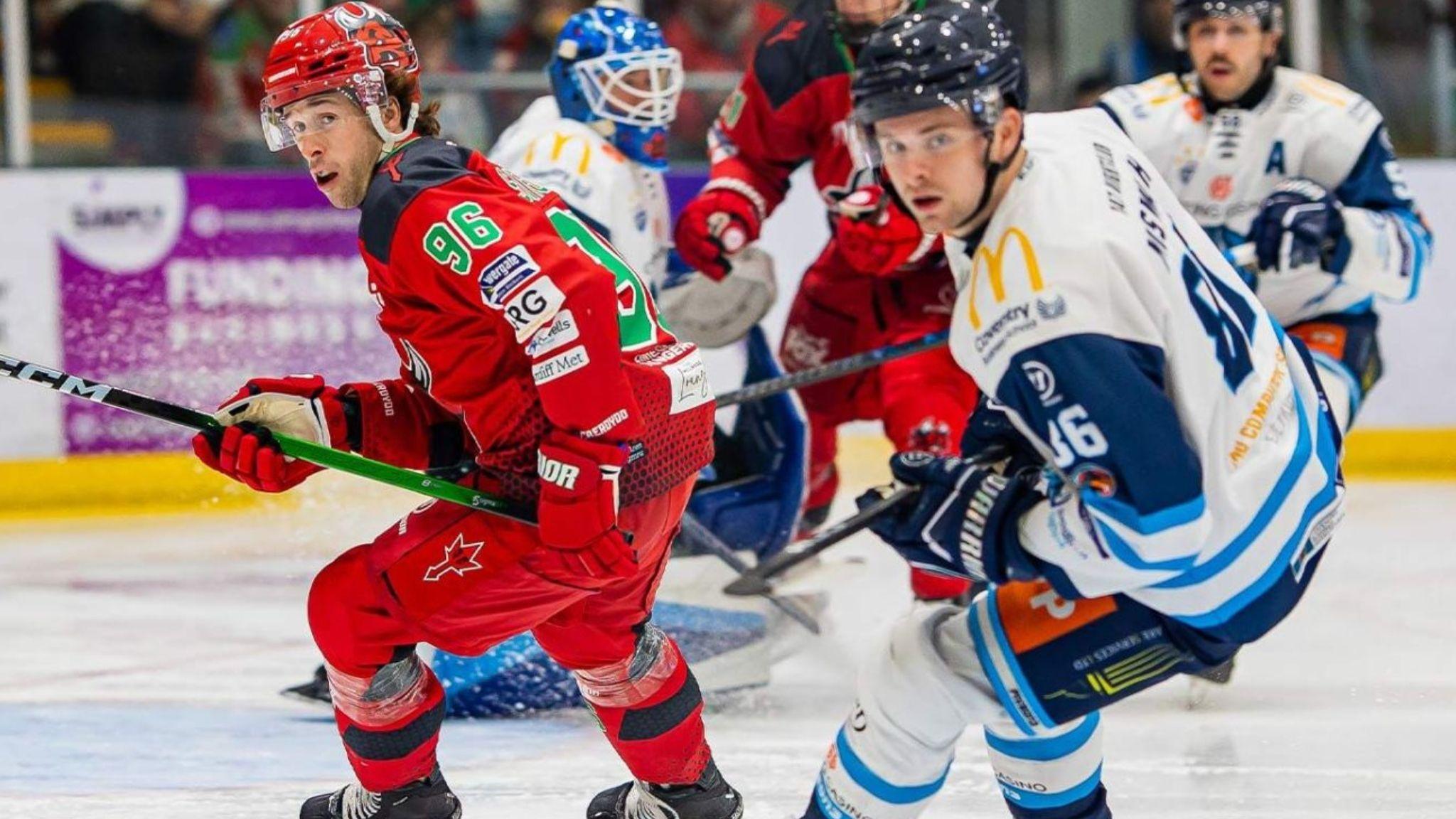 Cardiff Devils' Cole Sanford and Coventry Blaze's Grant Mismash follow the puck at the Vindico Arena