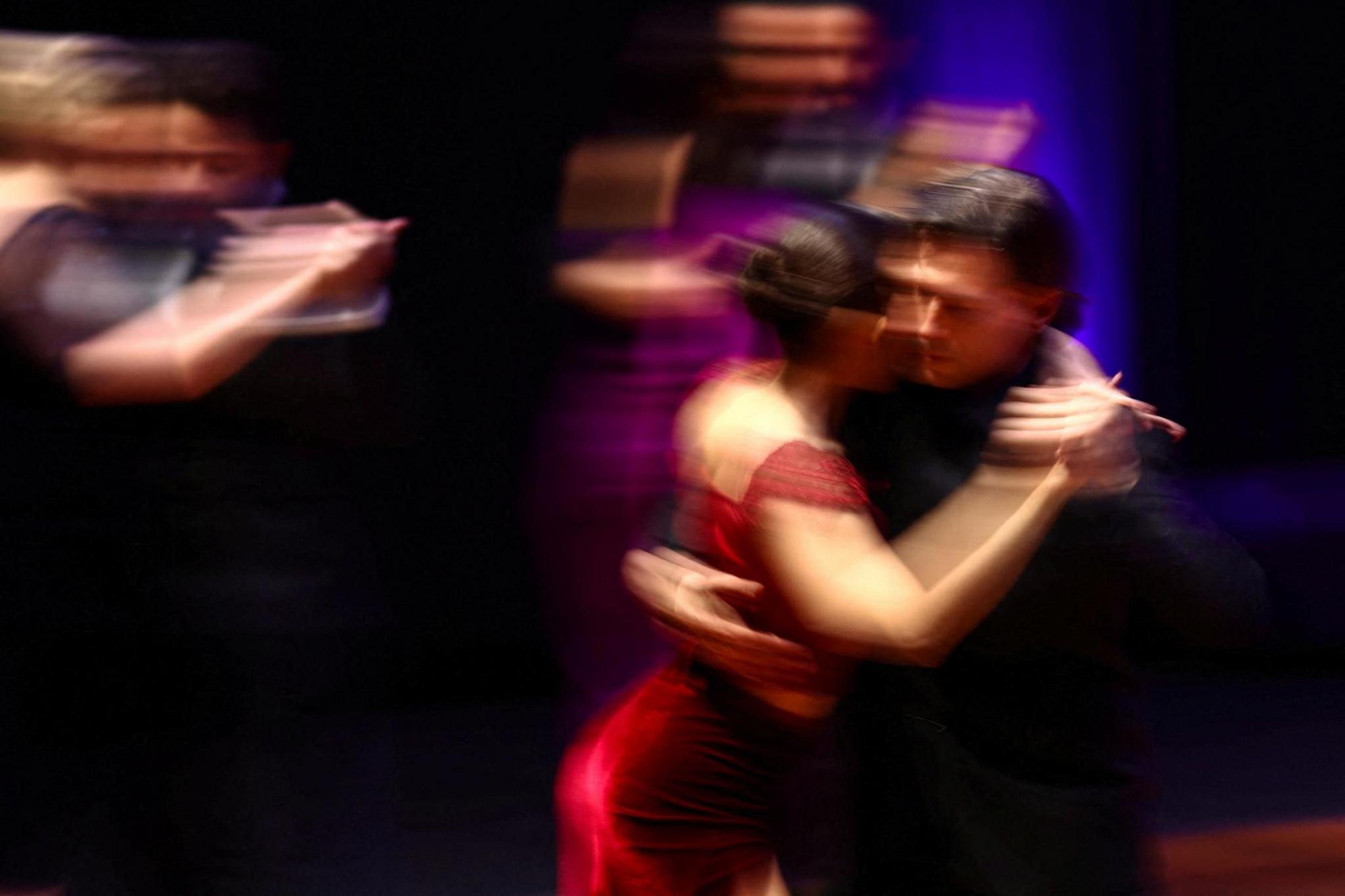 A man and a woman dance the tango