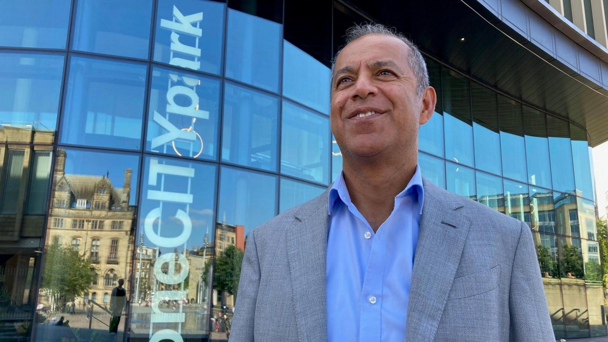 PwC's chairman for the North Armoghan Mohammed standing outside the new One City Park offices