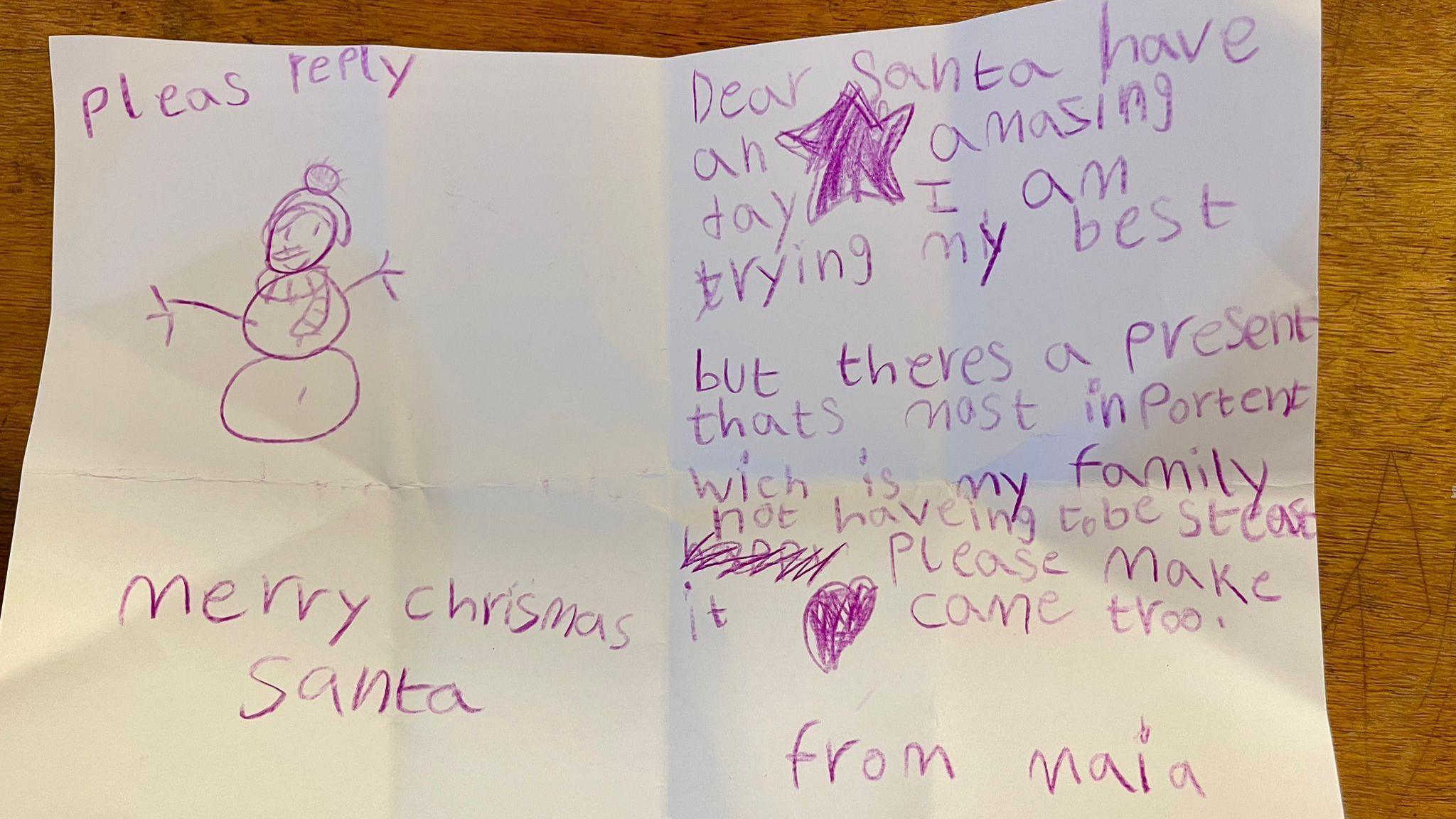 A paper letter to Santa from 8-year-old Maia Howell, it reads: "Dear Santa, have an amazing day. I am trying my best but there's a present that's most important which is my family not having to be stressed. Please make it come true. From Maia."