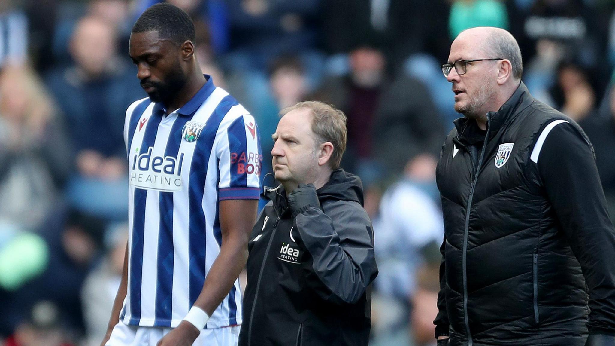 West Brom defender Semi Ajayi walks off after suffering a hamstring injury against Oxford United