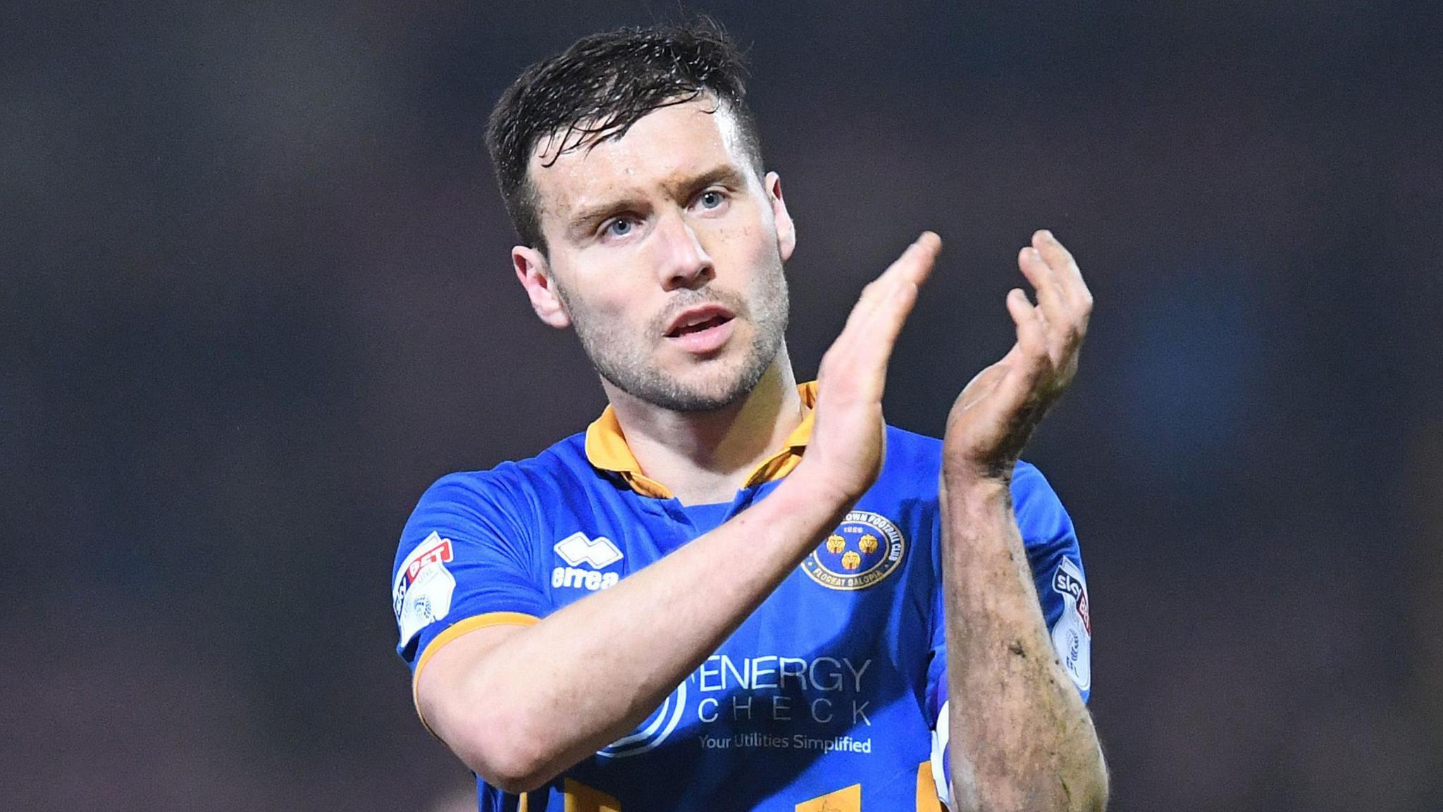Mat Sadler claps the crowd during his playing days for Shrewsbury Town