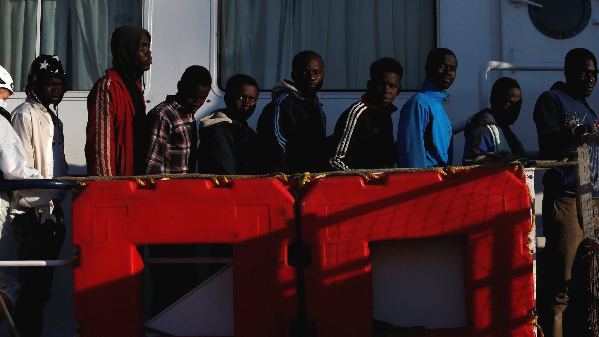 Rescued migrants wait to disembark from the Malta-based NGO Migrant Offshore Aid Station (MOAS) ship Phoenix in Pozzallo on the island of Sicily, Italy, 6 April 2017