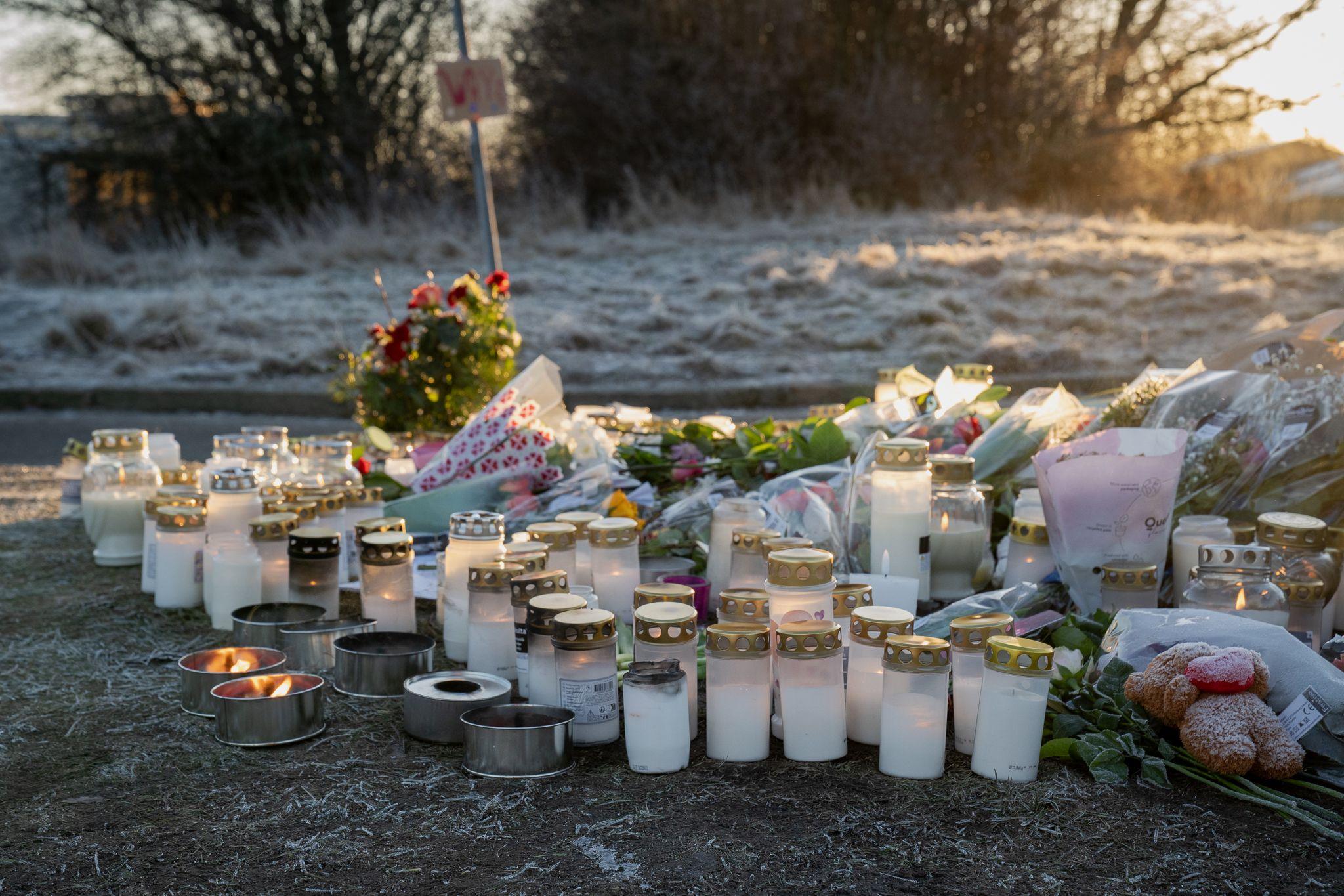 Mourners left candles and cards at the site of the shooting. Among them, a hand-written copy of John Donne's poem, No Man Is An Island.