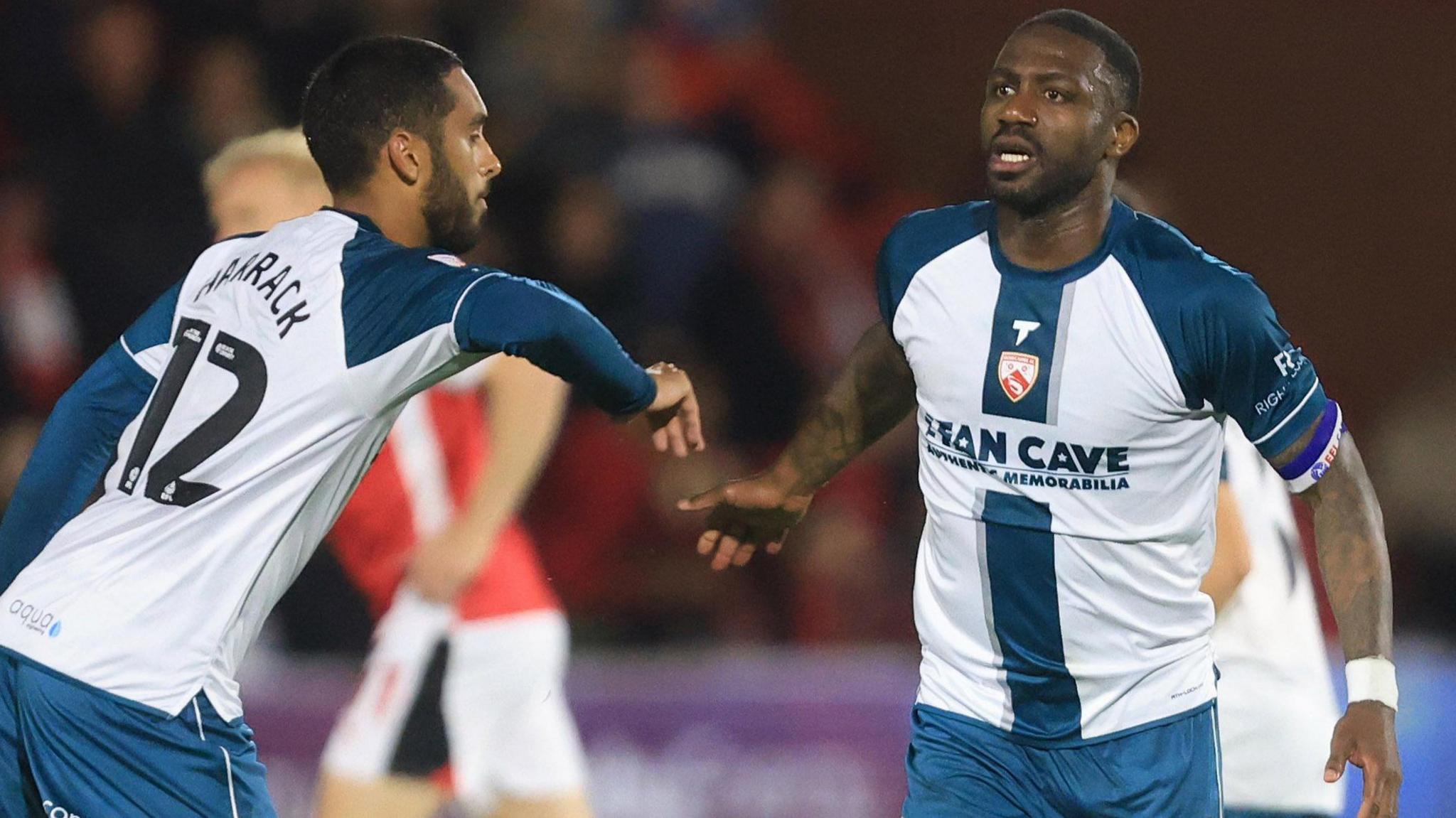 Yann Songo'o celebrates for Morecambe