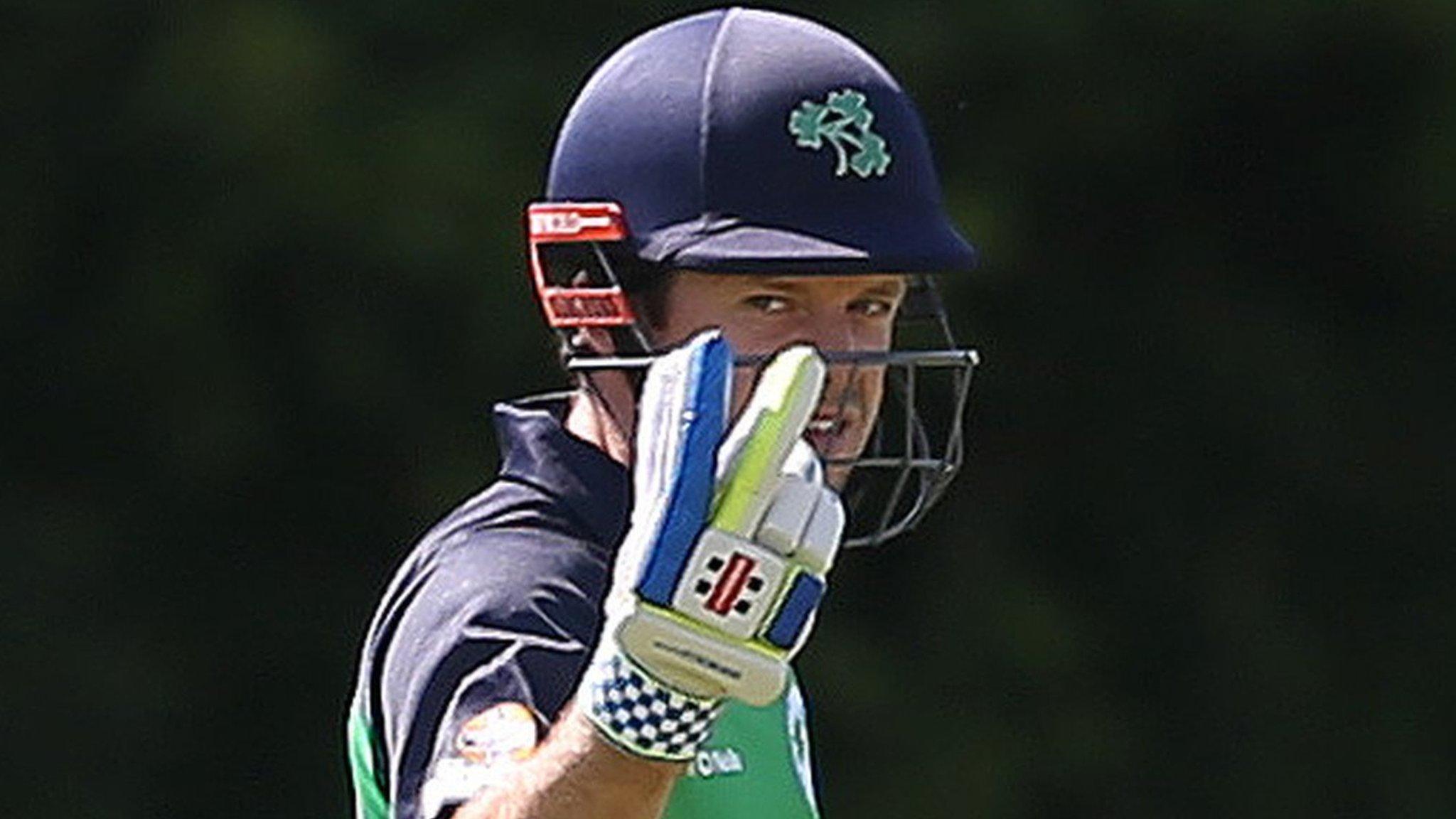 Ed Joyce gestures as he makes his way to the pavilion at Stormont following his controversial run out