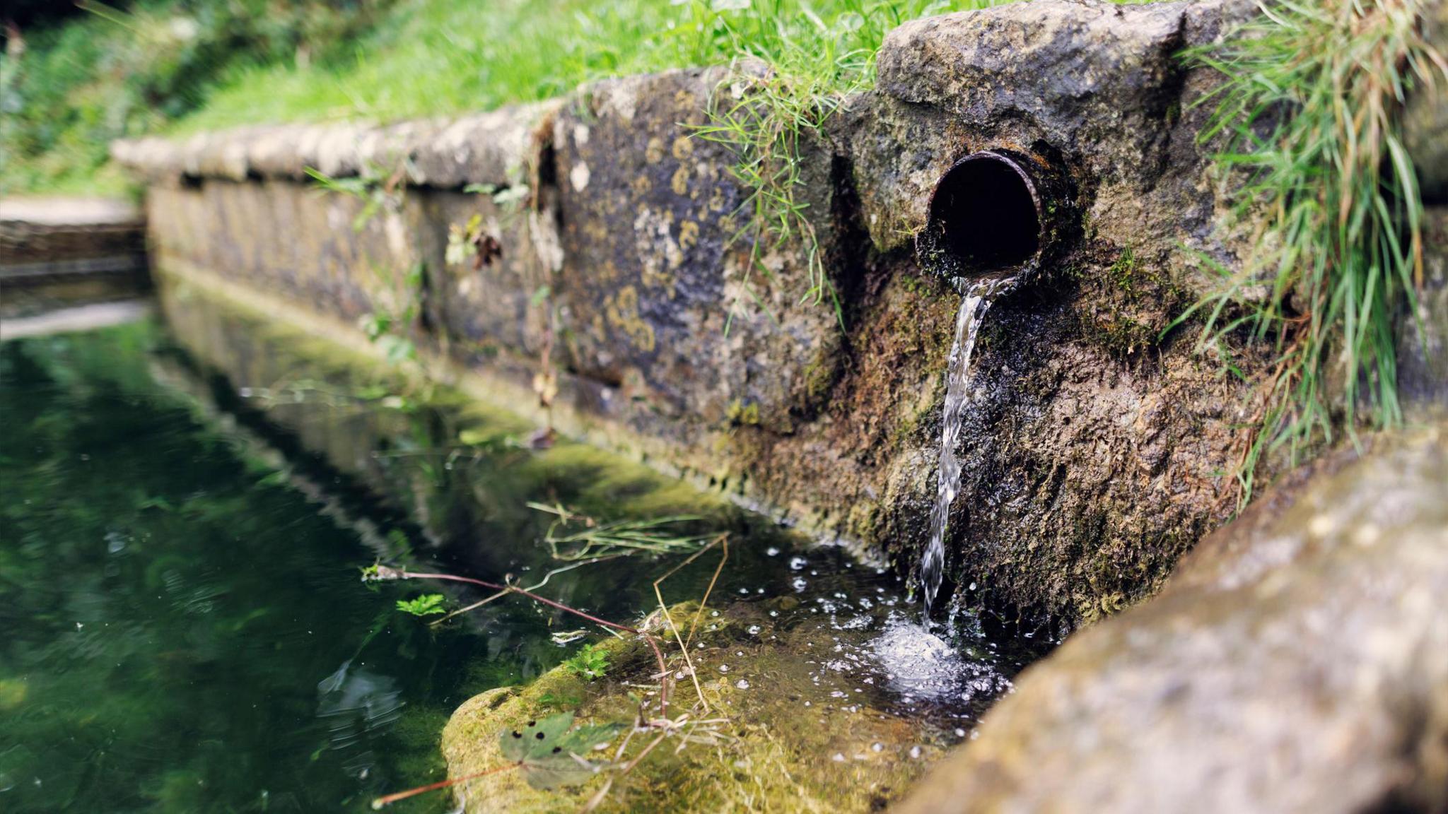 water pipe, going into river